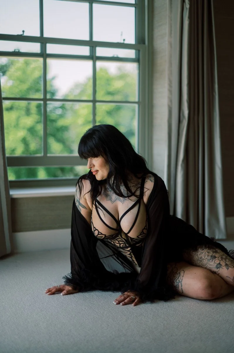  Woman during a luxury boudoir photoshoot in Hampshire, feeling confident and comfortable in a private natural-light setting. 