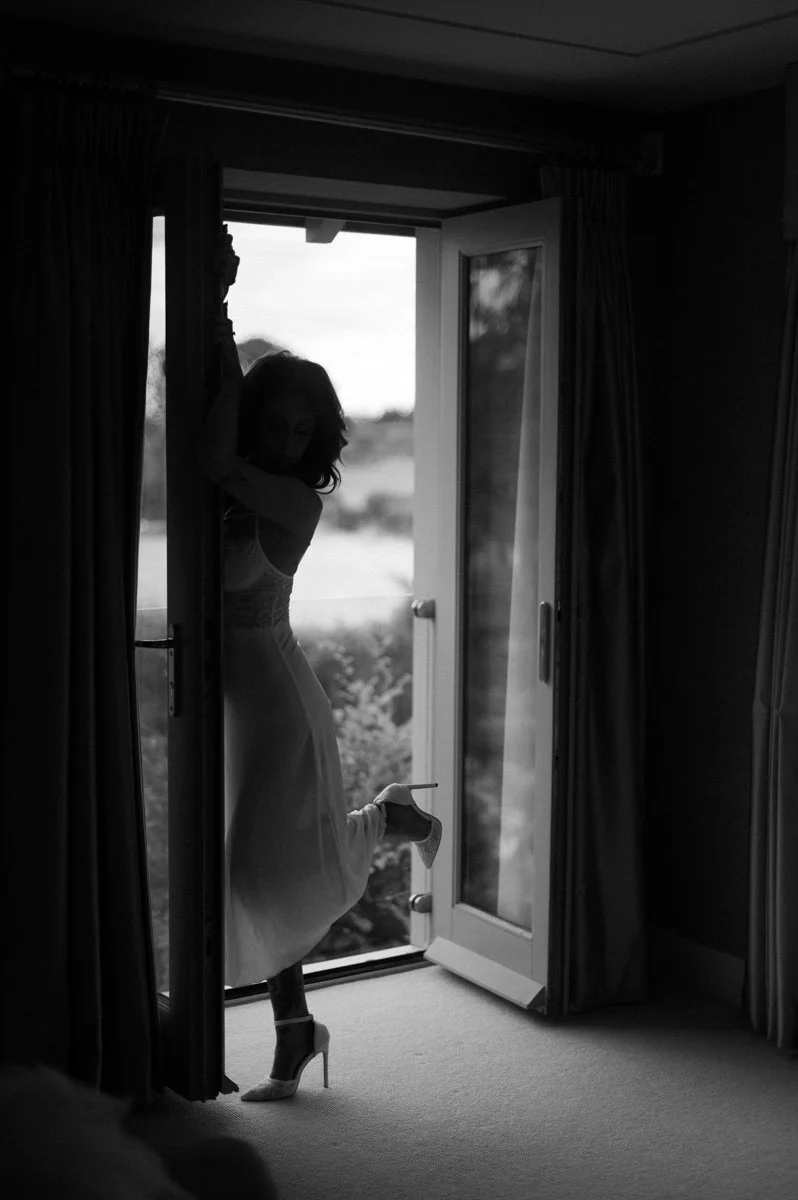  Bride-to-be during a luxury bridal boudoir photoshoot in Hampshire before her September wedding at Clock Barn. 