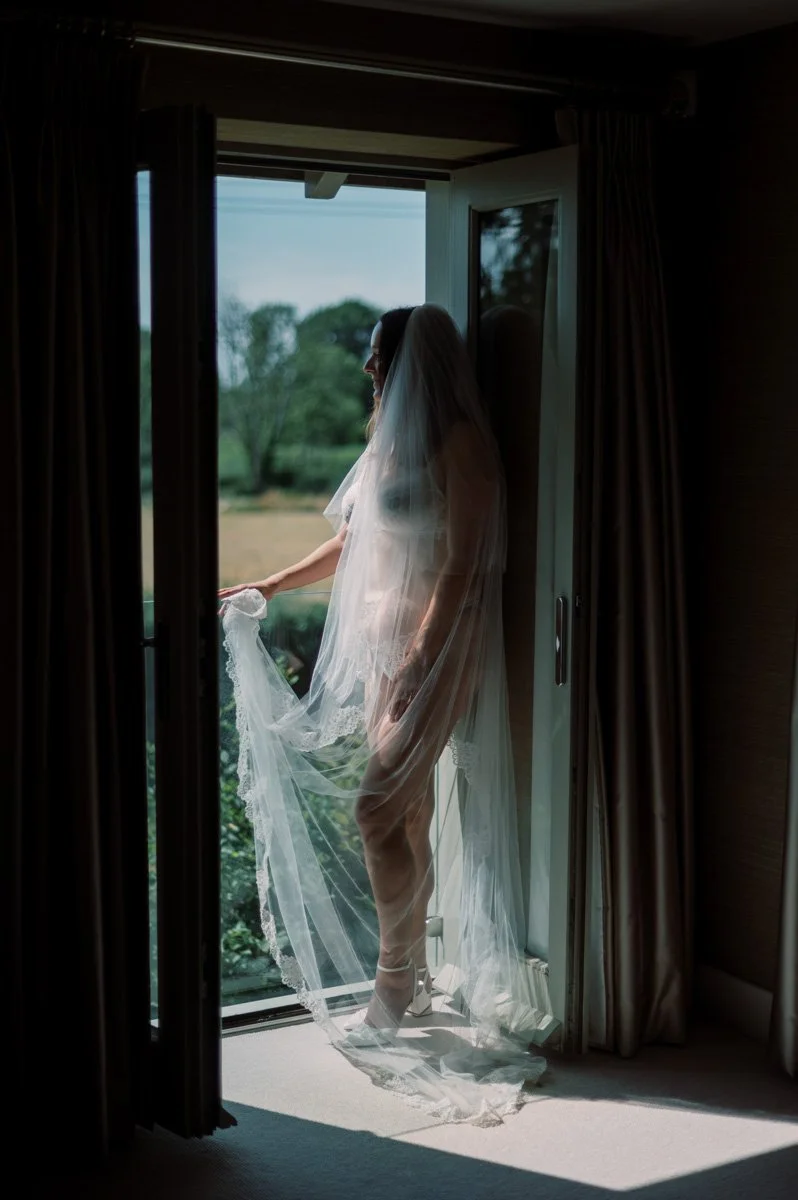  Natural light bridal boudoir portrait celebrating the excitement before an October wedding. 
