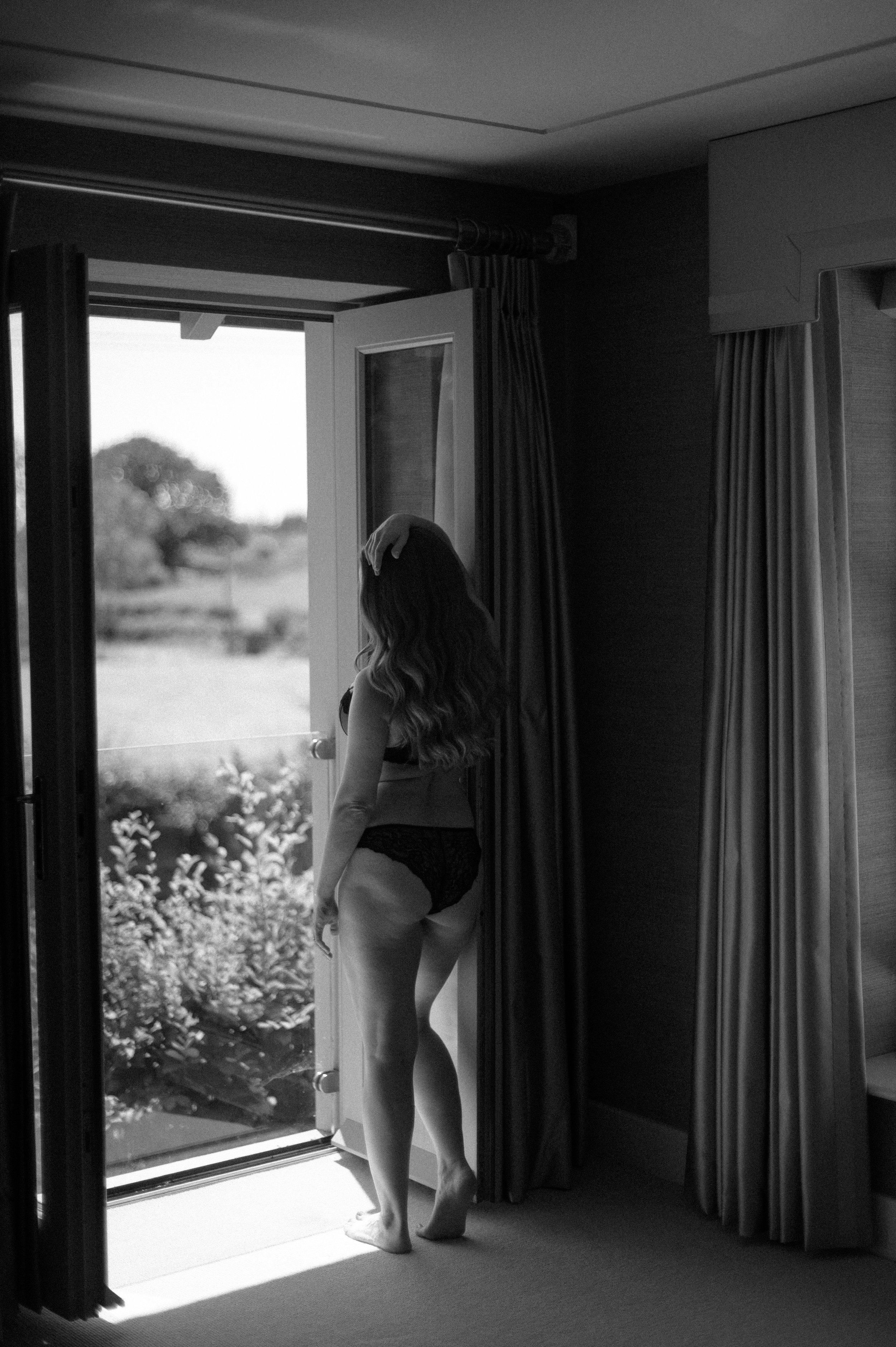 Natural light bridal portrait with soft, feminine styling