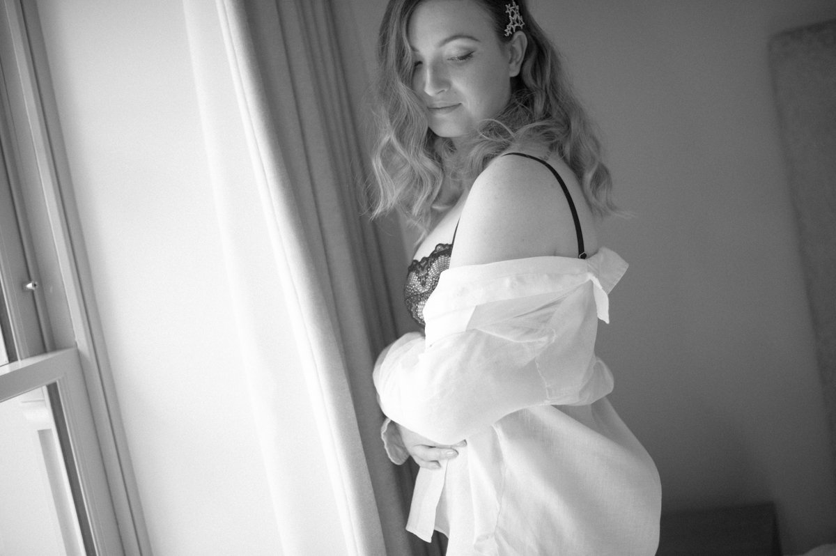 woman dressed in shirt in window