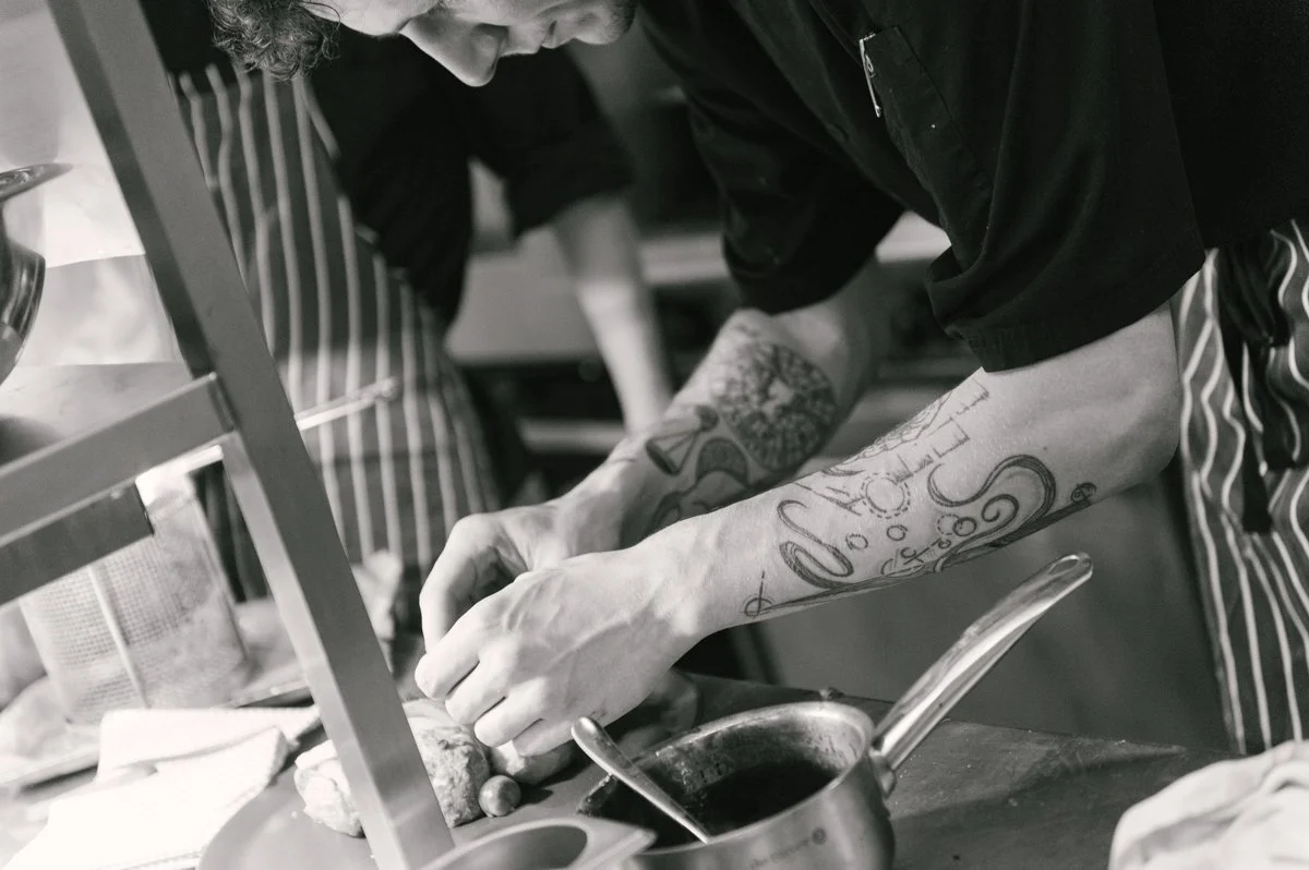 Chef working in the kitchen of an independent Hampshire pub during a brand photography shoot