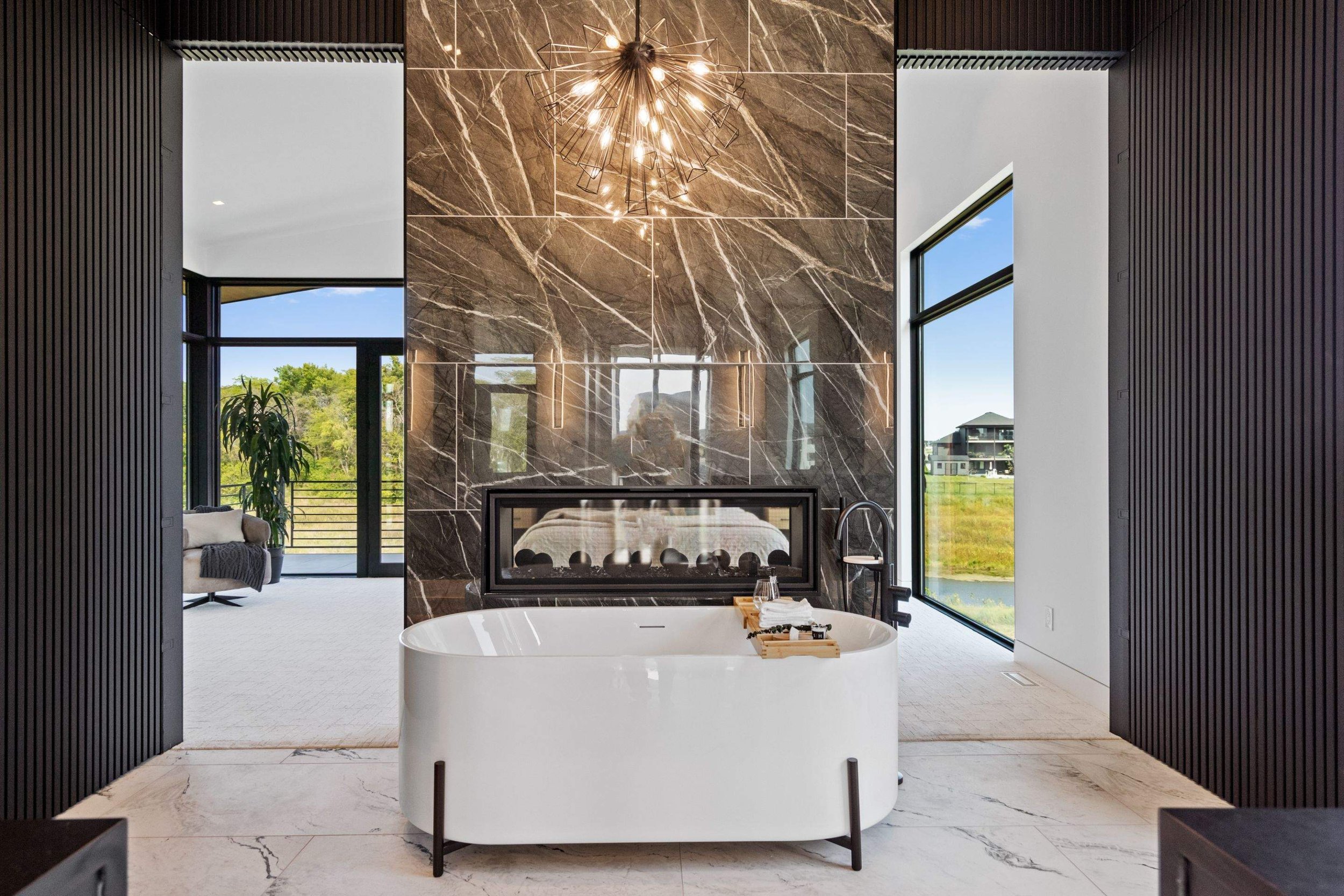 The freestanding tub is accentuated by sleek accent lighting and precision low-voltage wiring, combining luxury with energy efficiency.