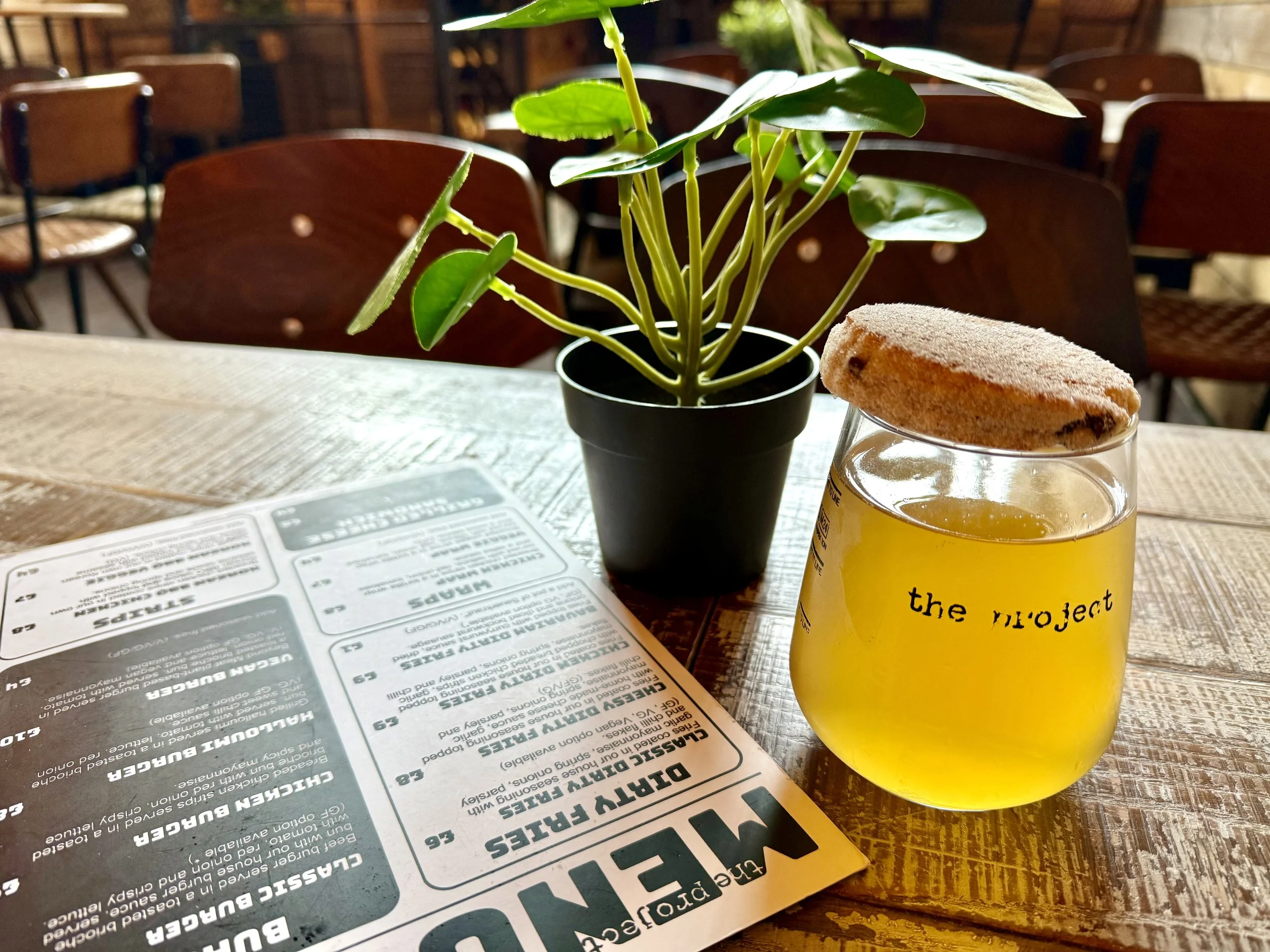 A glass of Tenjin Hard Ginger Beer with a Welsh Cake on Top