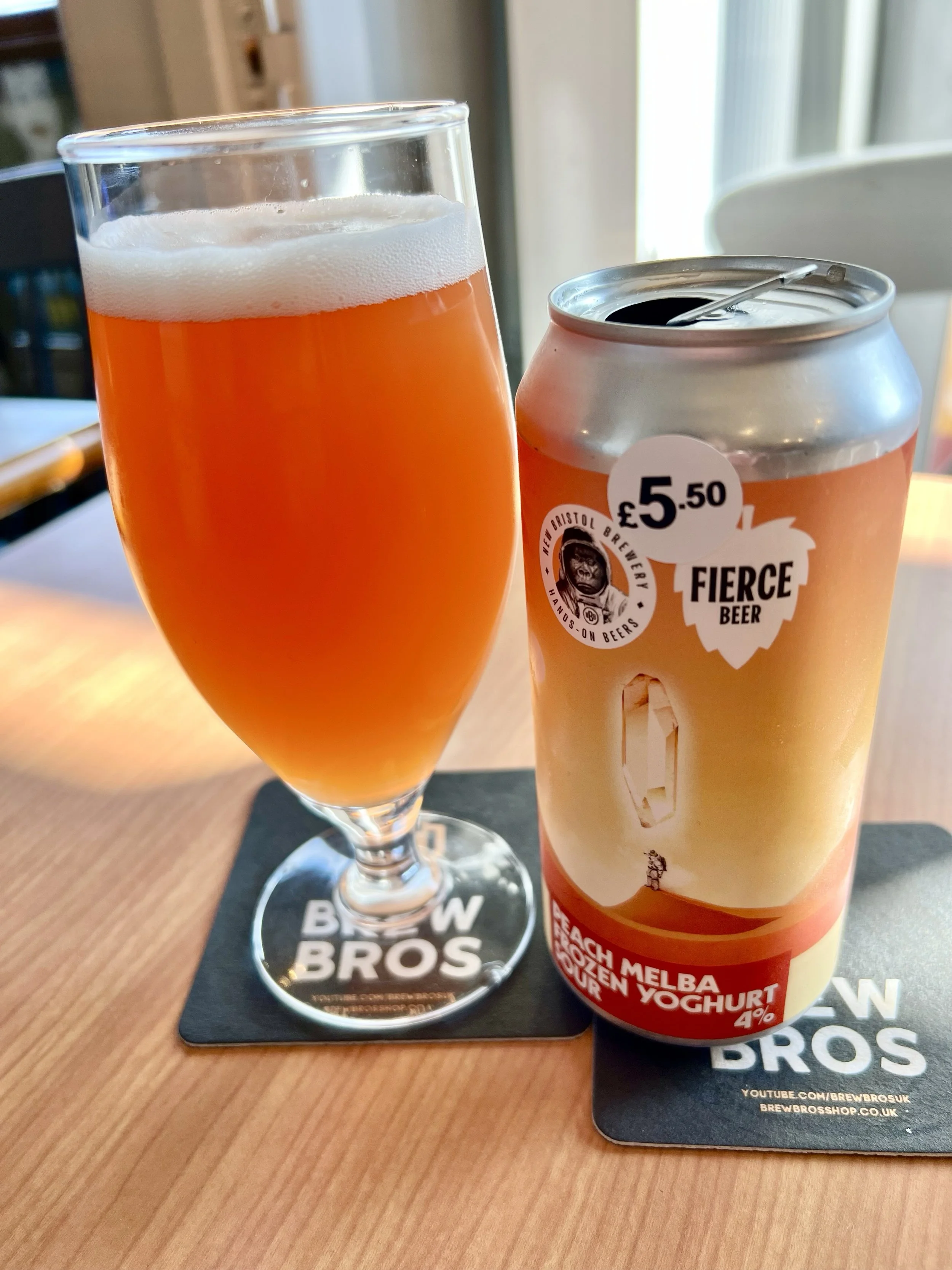 A poured Can of Peach Melba Frozen Youhurt Sour - New Bristol / Fierce Beer