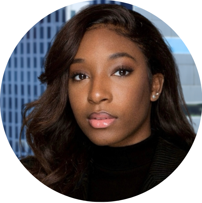 Portrait of a young African American woman with long wavy hair, wearing pearl earrings and a black top, with a cityscape background.