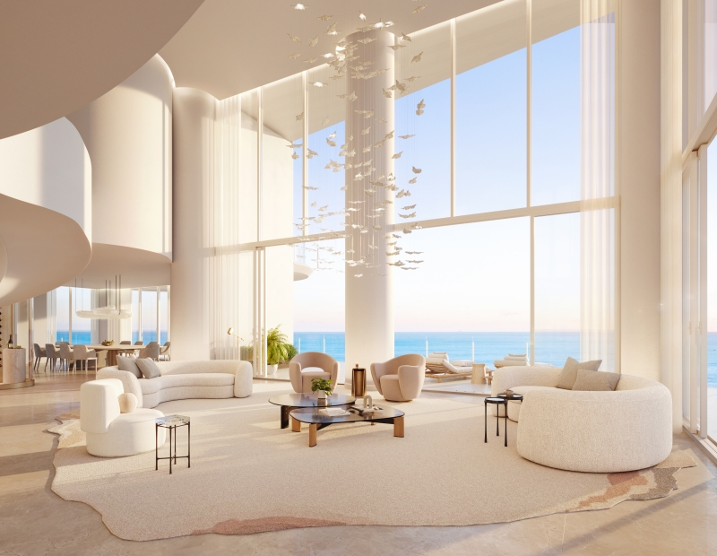 A cream-colored multi-story fancy room with an ocean view