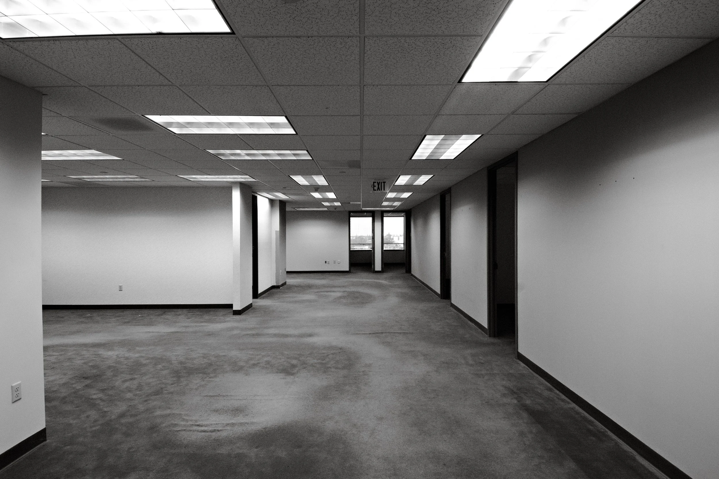 Bleak office space with no furniture.