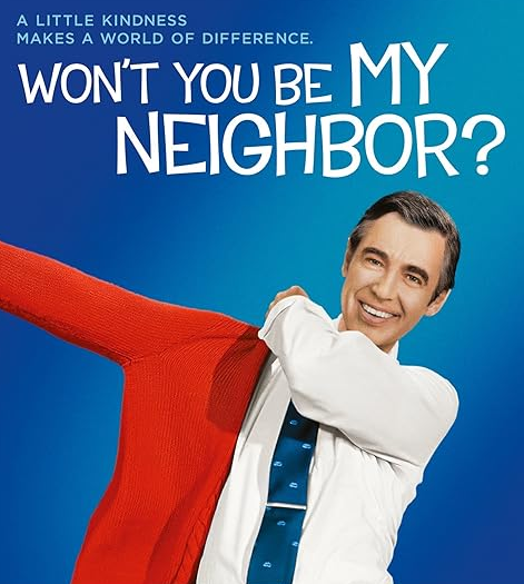 Image of Mr. Rogers putting on a red sweater with the title of the documentary, Won't You Be My Neighbor? and the text: A Little Kindness Makes a World of Difference