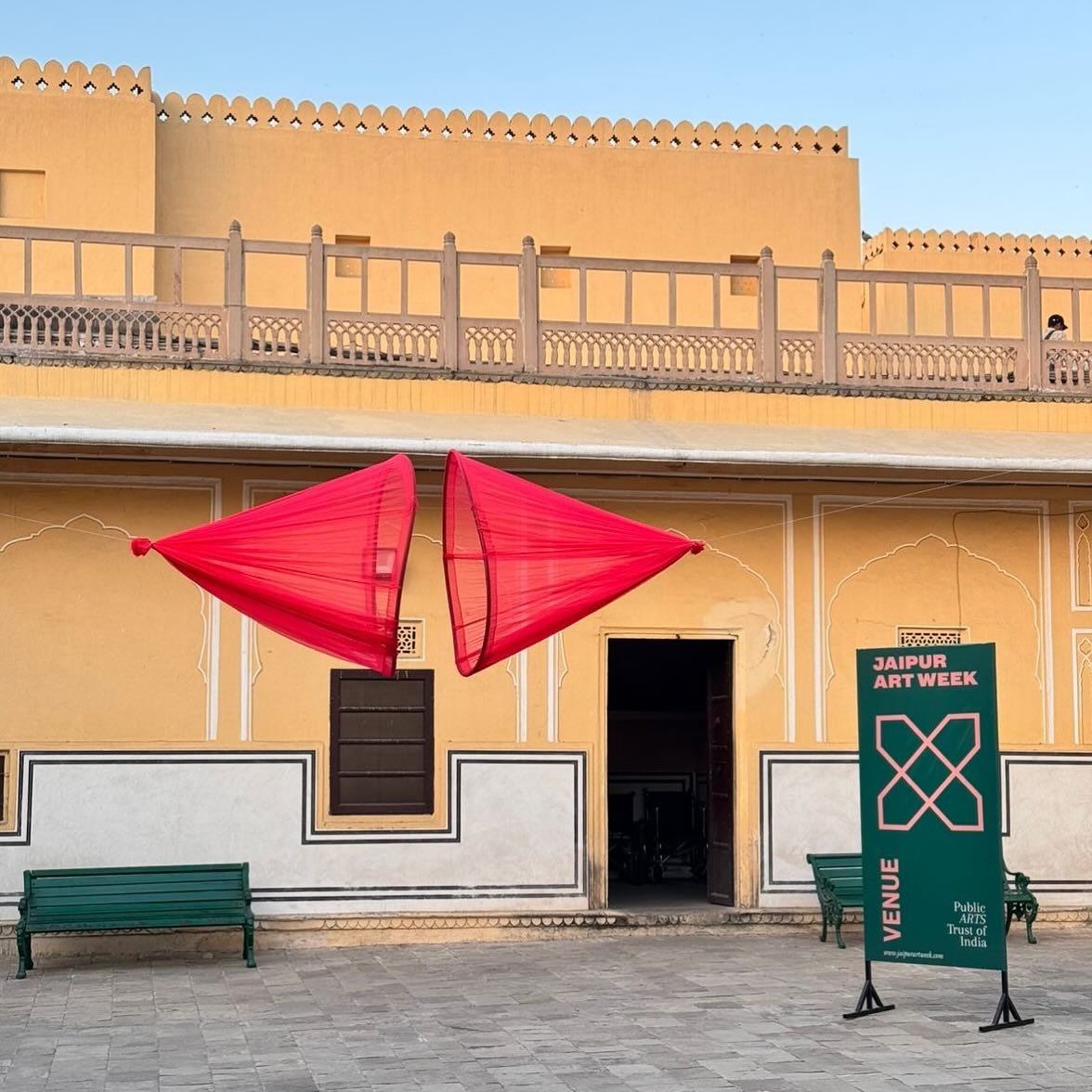 Jaipur Art Week 4.0 I Hawa Mahal
Vagaram Choudhary &mdash; Social Spam (2025)

Against the majestic jharokhas of Hawa Mahal, Social Spam by Vagaram Choudhary unfolds as a fabric-based installation that draws attention to the unseen architecture of so