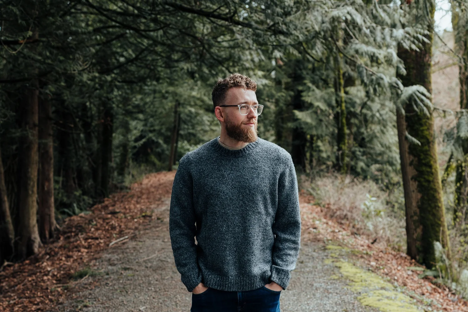 Brandon Bate, Registered Clinical Counsellor, on a forest path