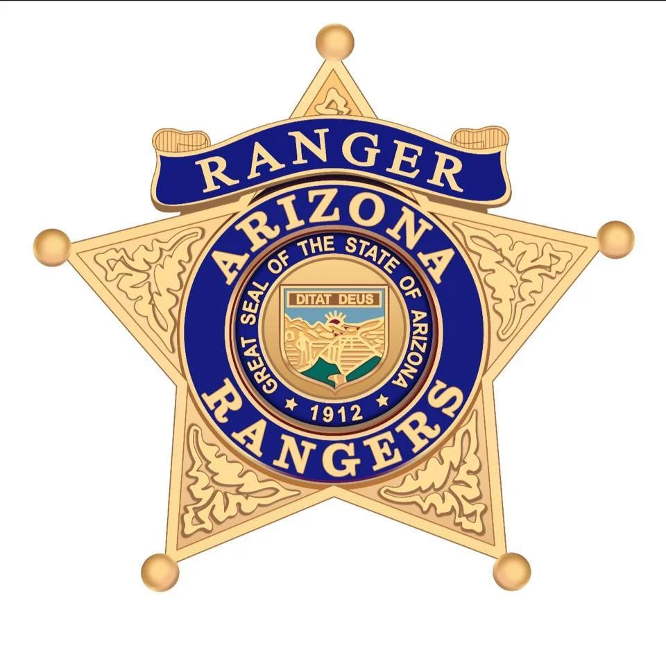 Illustration of a sheriff's star badge for the Arizona Rangers, featuring a gold-colored five-point star with decorative elements and a central circular emblem.