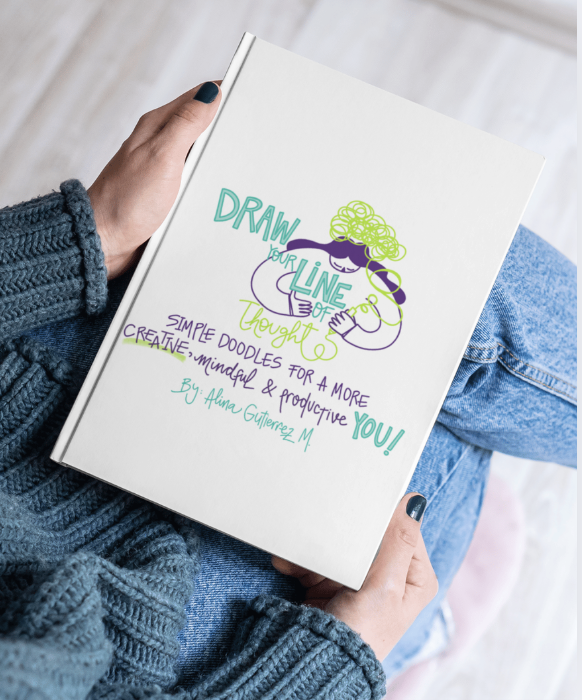 Hand holding Visual Versa workbook “Draw Your Line of Thought”, representing visual thinking, visual note taking learning and creative self-expression through drawing