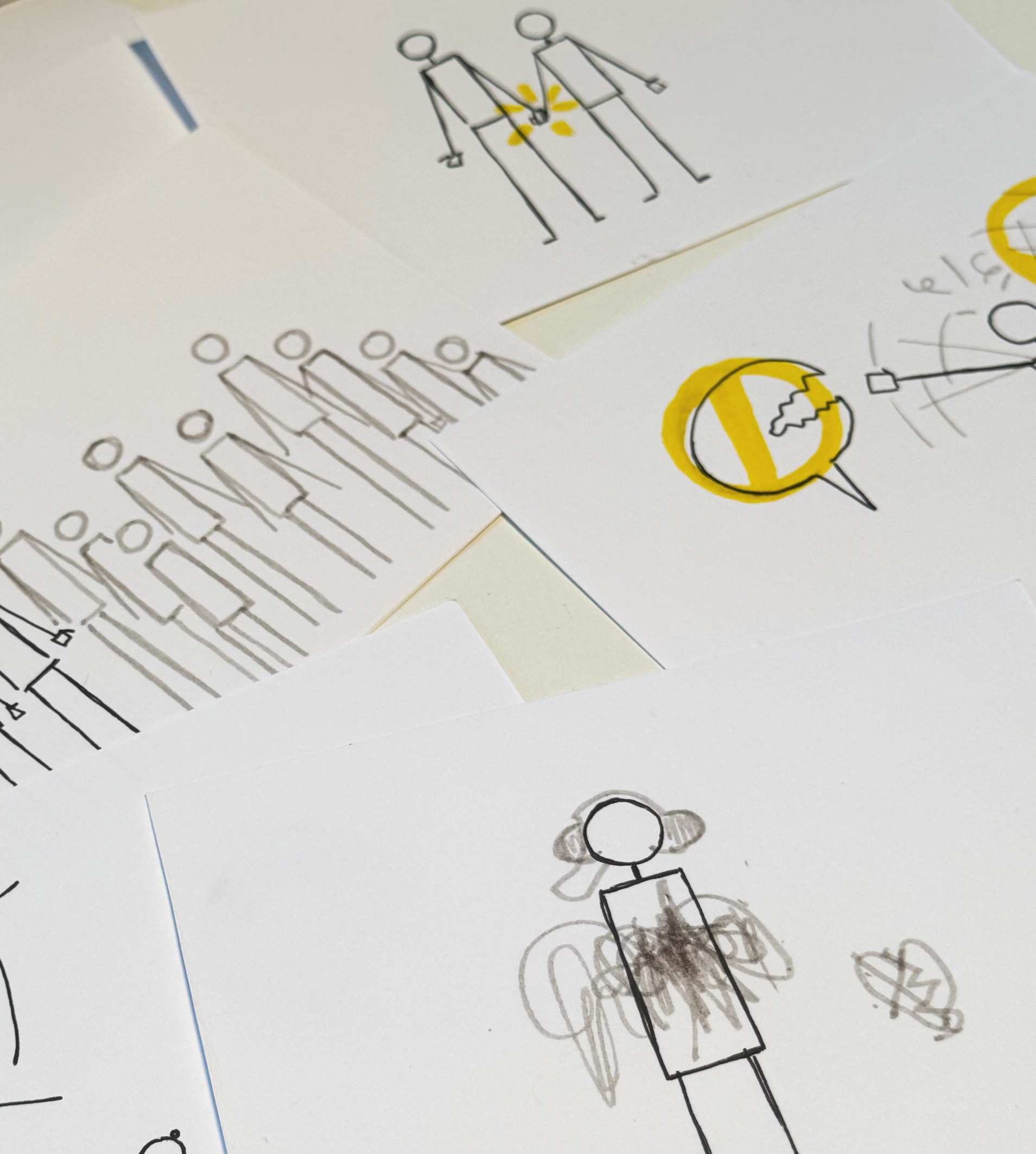 Hand-drawn visual notes and character sketches on paper with markers, representing visual thinking process, ideation and visual communication practice used in Visual Versa training