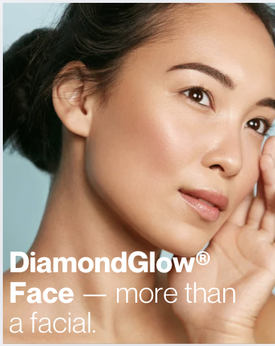 Close-up of a woman with smooth skin, touching her face gently, with text overlay promoting DiamondGlow facial treatment.