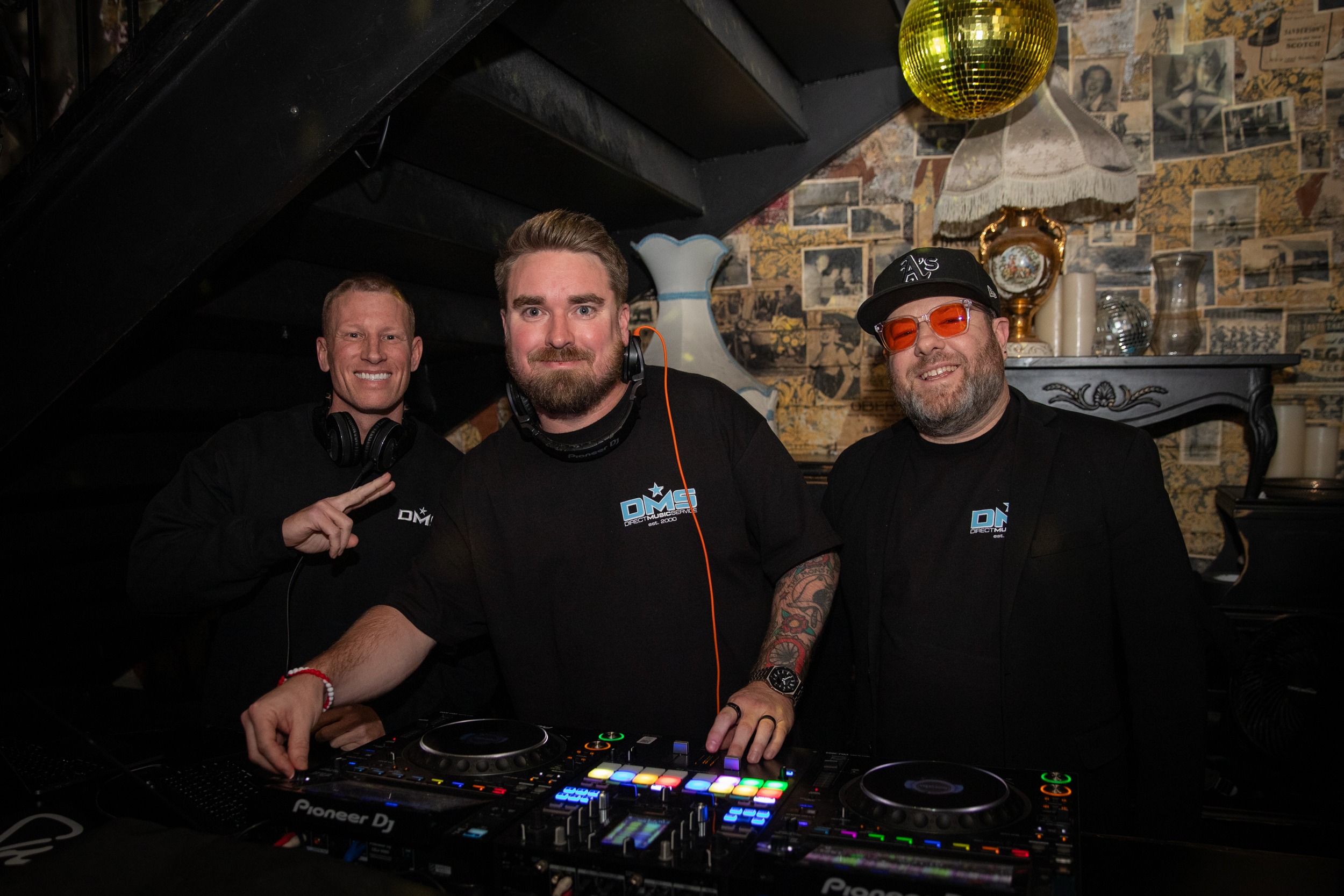 DJ Grant, DJ Fuse A.K.A. Fuseamania, and Drew Pierce in a nightclub in Las Vegas.
