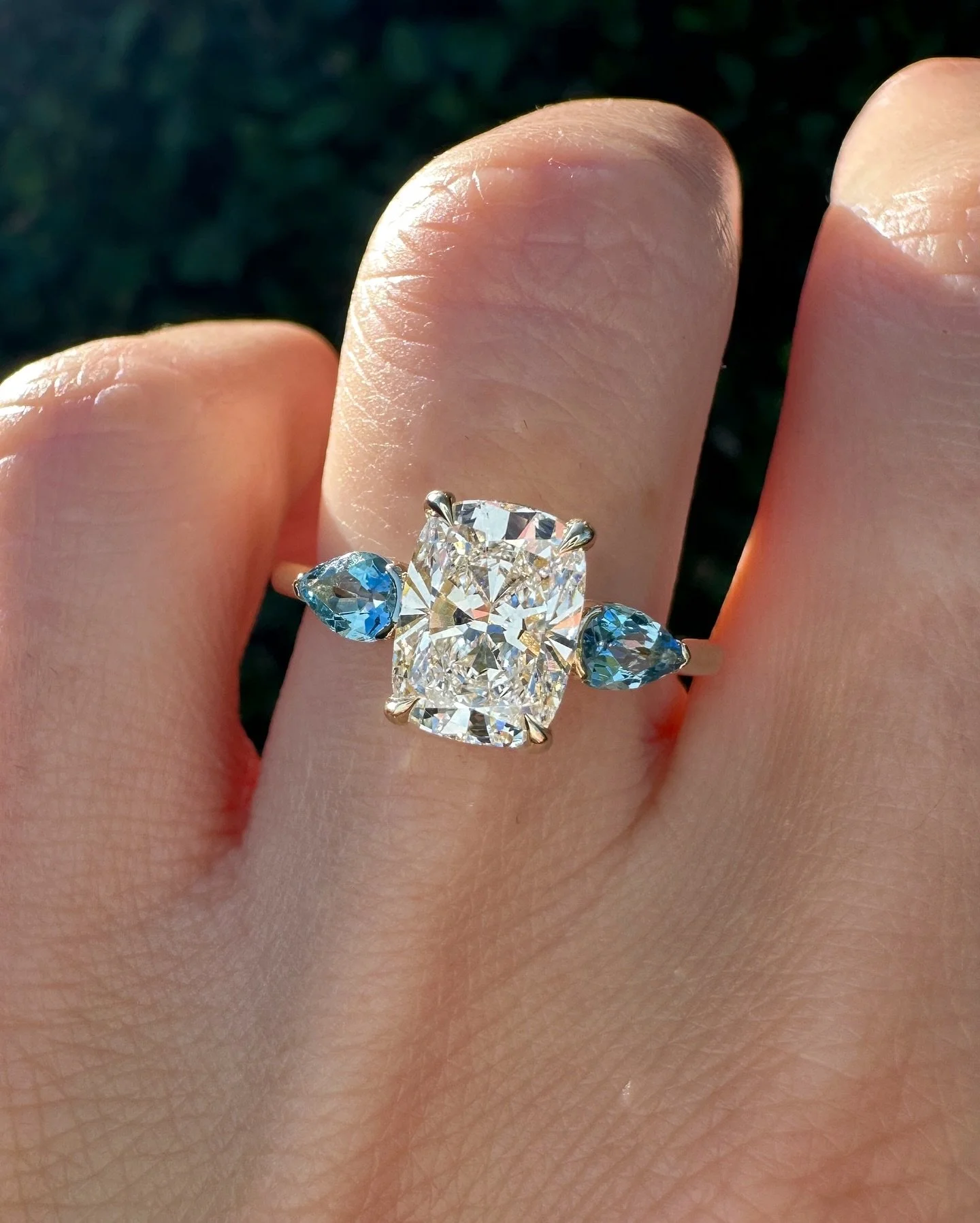 Swipe for more angles of this stunning 1.5ct Cushion cut with aquamarine side stones. ✨🩵

#cushioncut #diamondring #engaged #engagementring #aquamarine