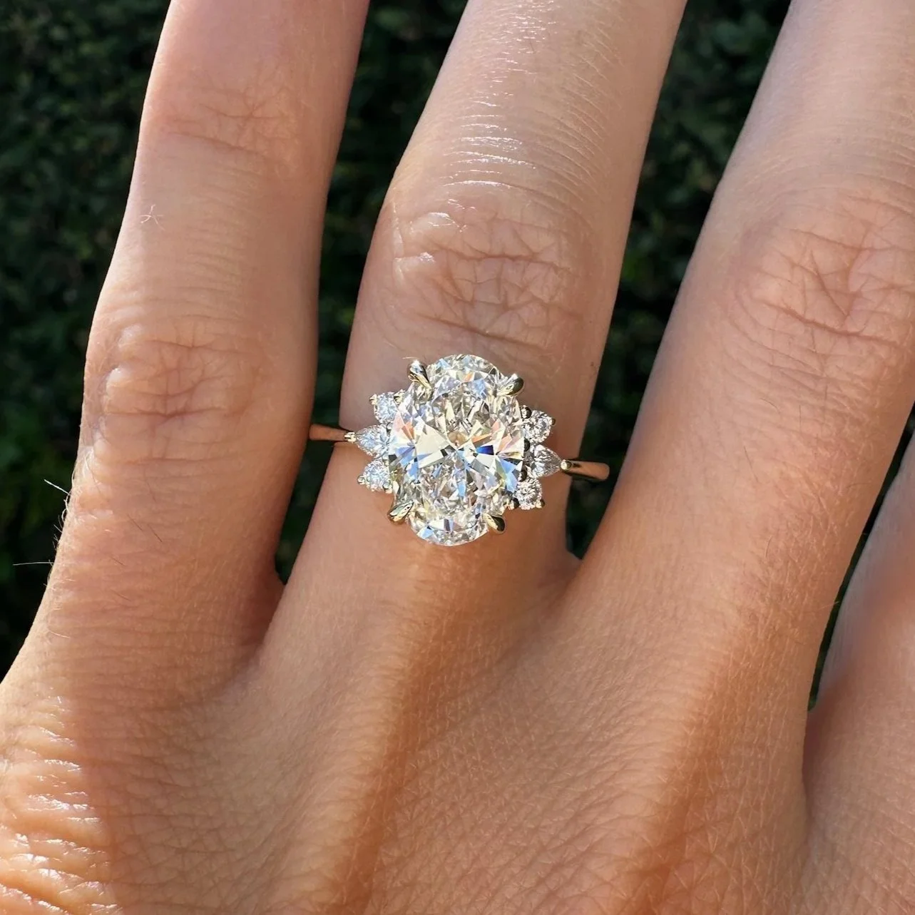 Oval diamond cluster engagement ring