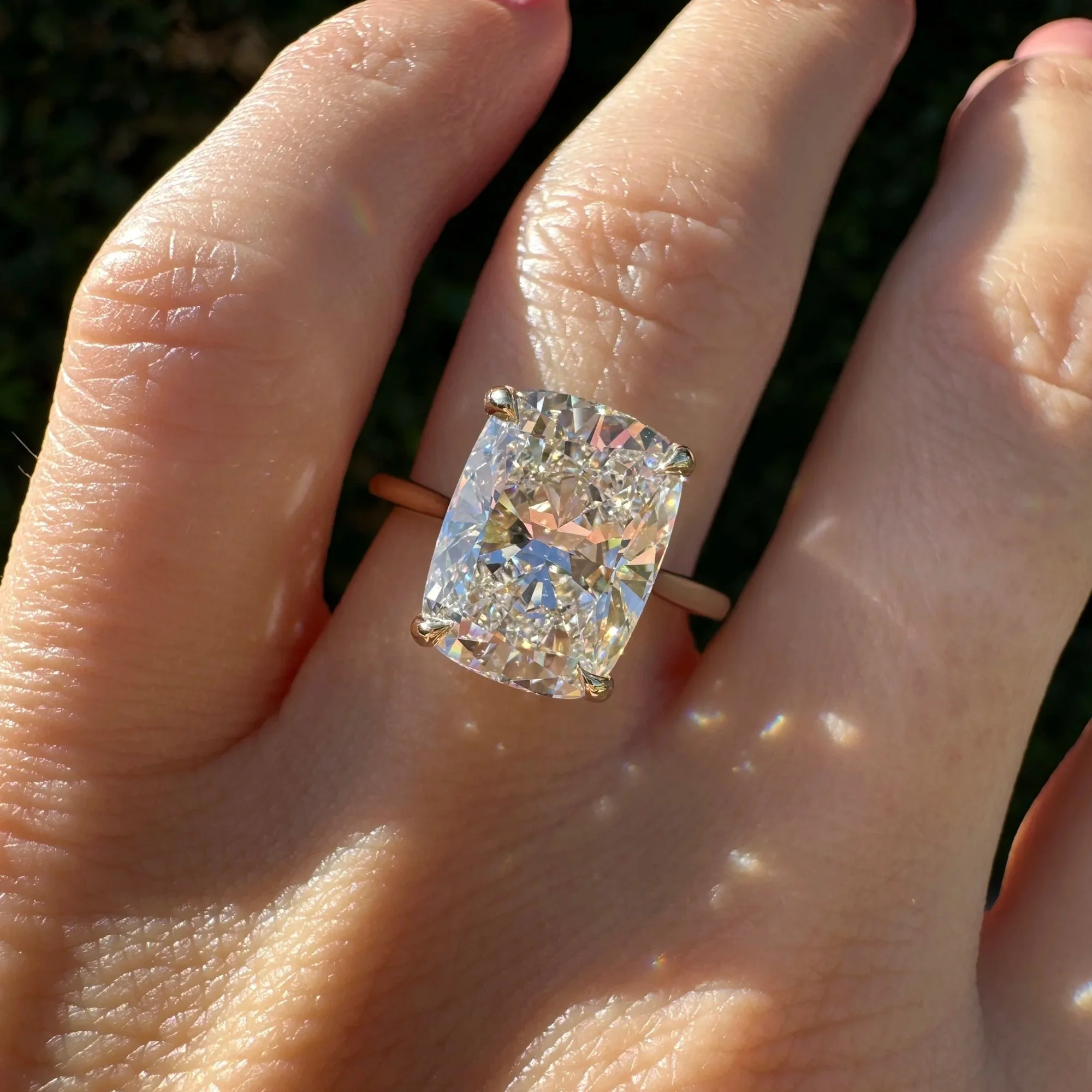 Elongated cushion-cut diamond solitaire on a yellow gold band