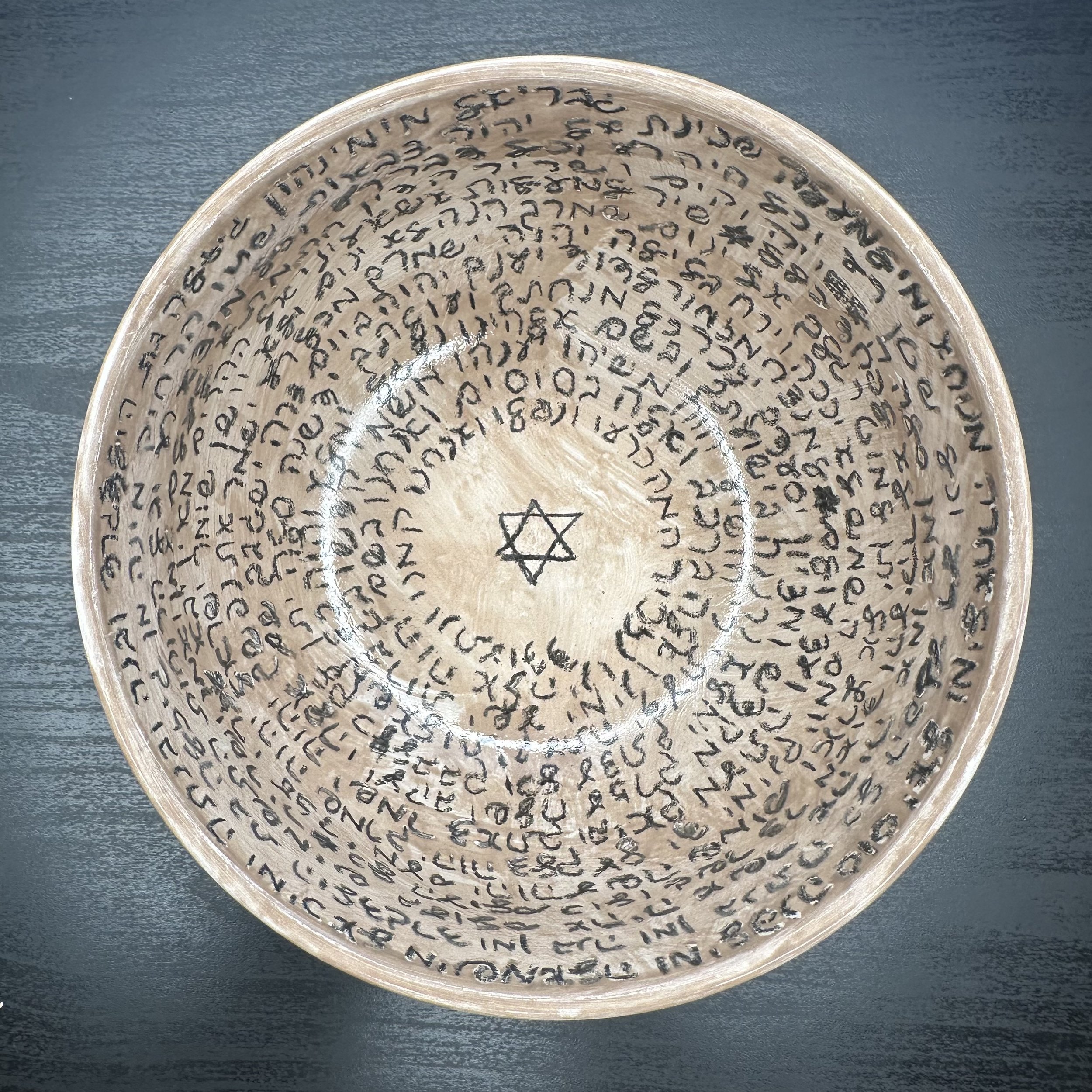 Unglazed incantation bowl in light brown