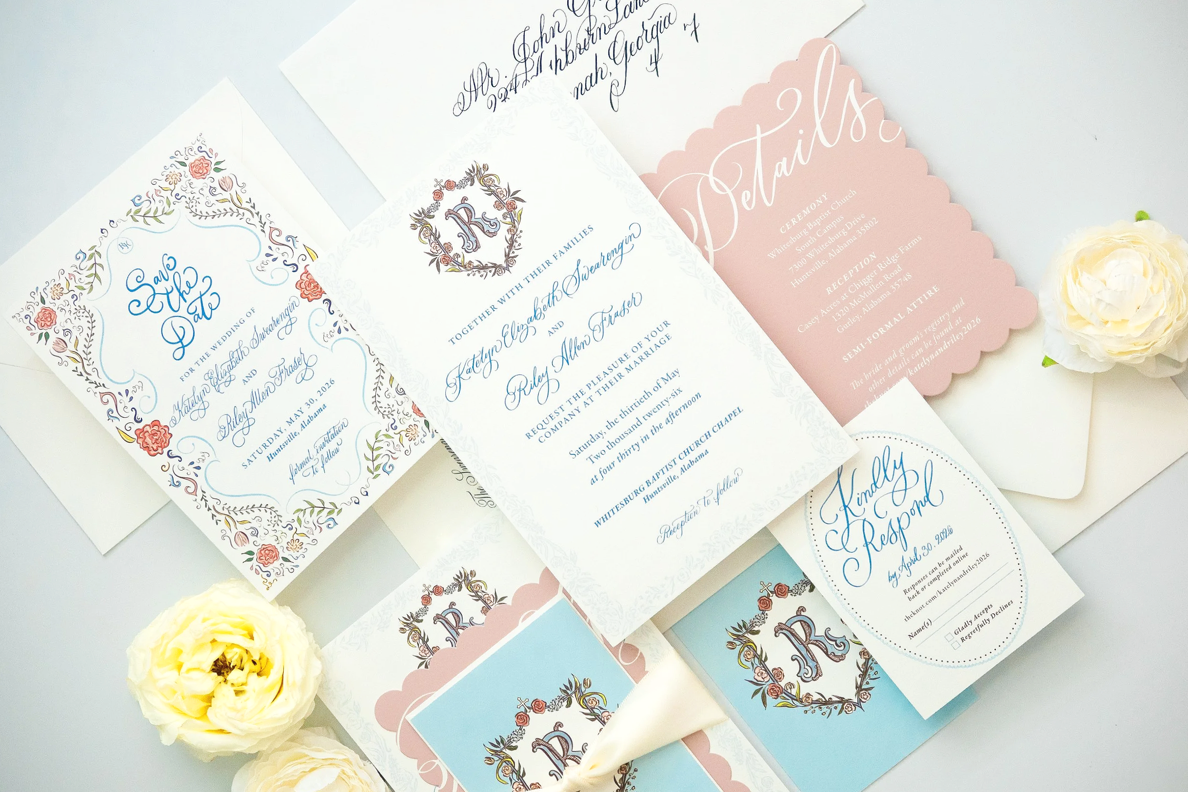 Collection of wedding invitation cards created by Bella Taylor with floral and decorative designs, along with white flowers on a light background.