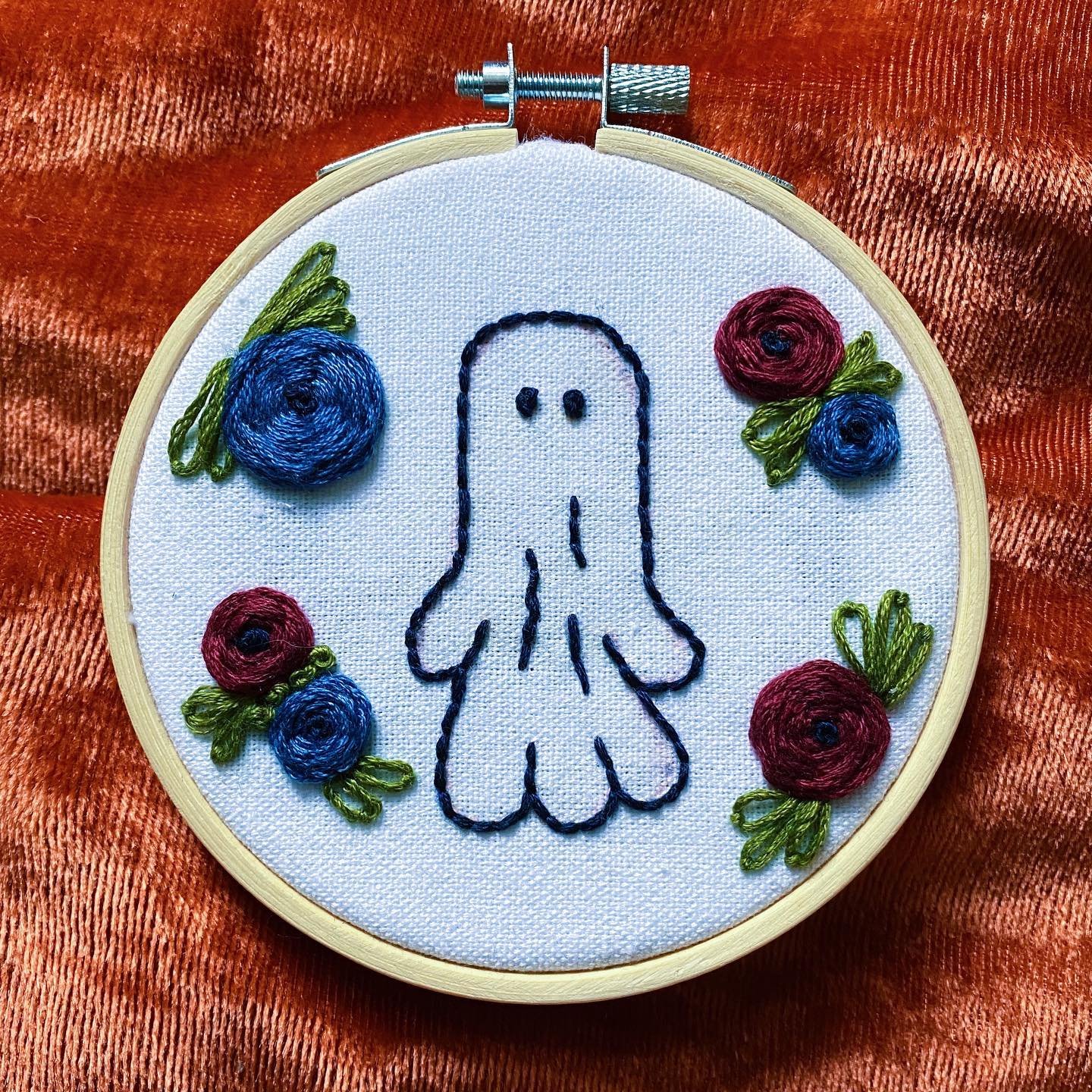 SOLD 👻 I love sewing lil ghosts on black fabric, but there&rsquo;s something special about this bright bb. Love the flower color combo on this one, sewn on a 4&rdquo; hoop 🌺