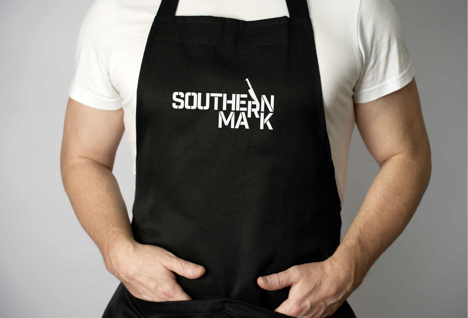 Person wearing a black apron with the text 'Southern MA RK' printed on it, standing against a plain background.