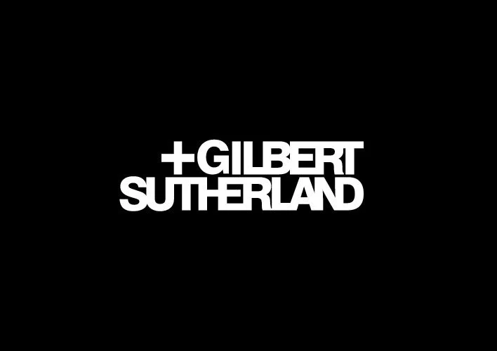 White text on a black background reads '+GILBERT SUTHERLAND' with a plus sign preceding the name.