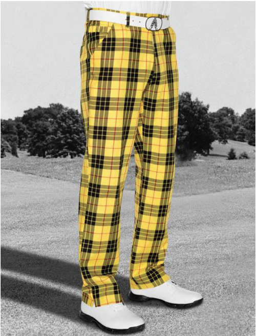 Person wearing yellow plaid golf pants, white belt, white golf shoes, standing outdoors with grass and trees in the background.
