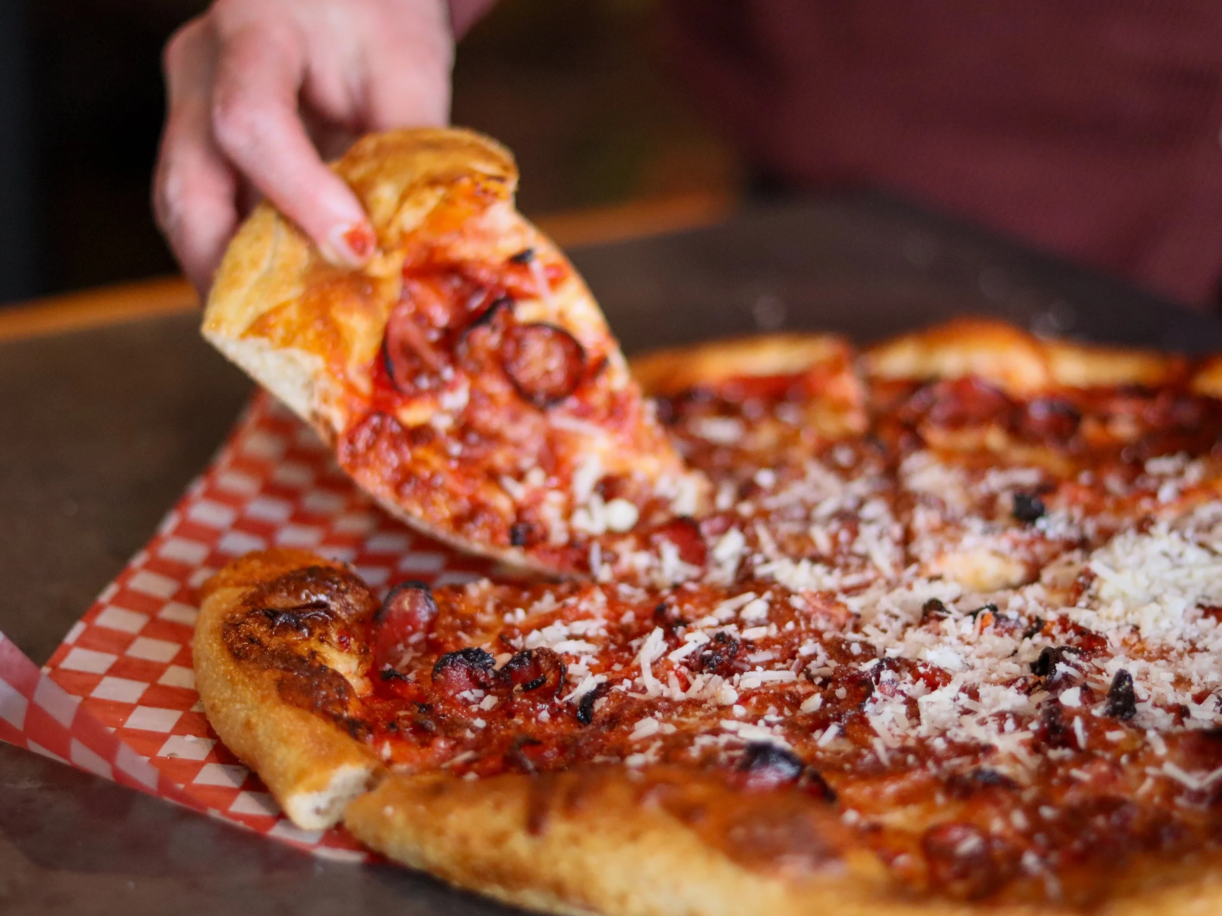 New York style pepperoni pizza from Connie and John's Pizza served on the rooftop patio