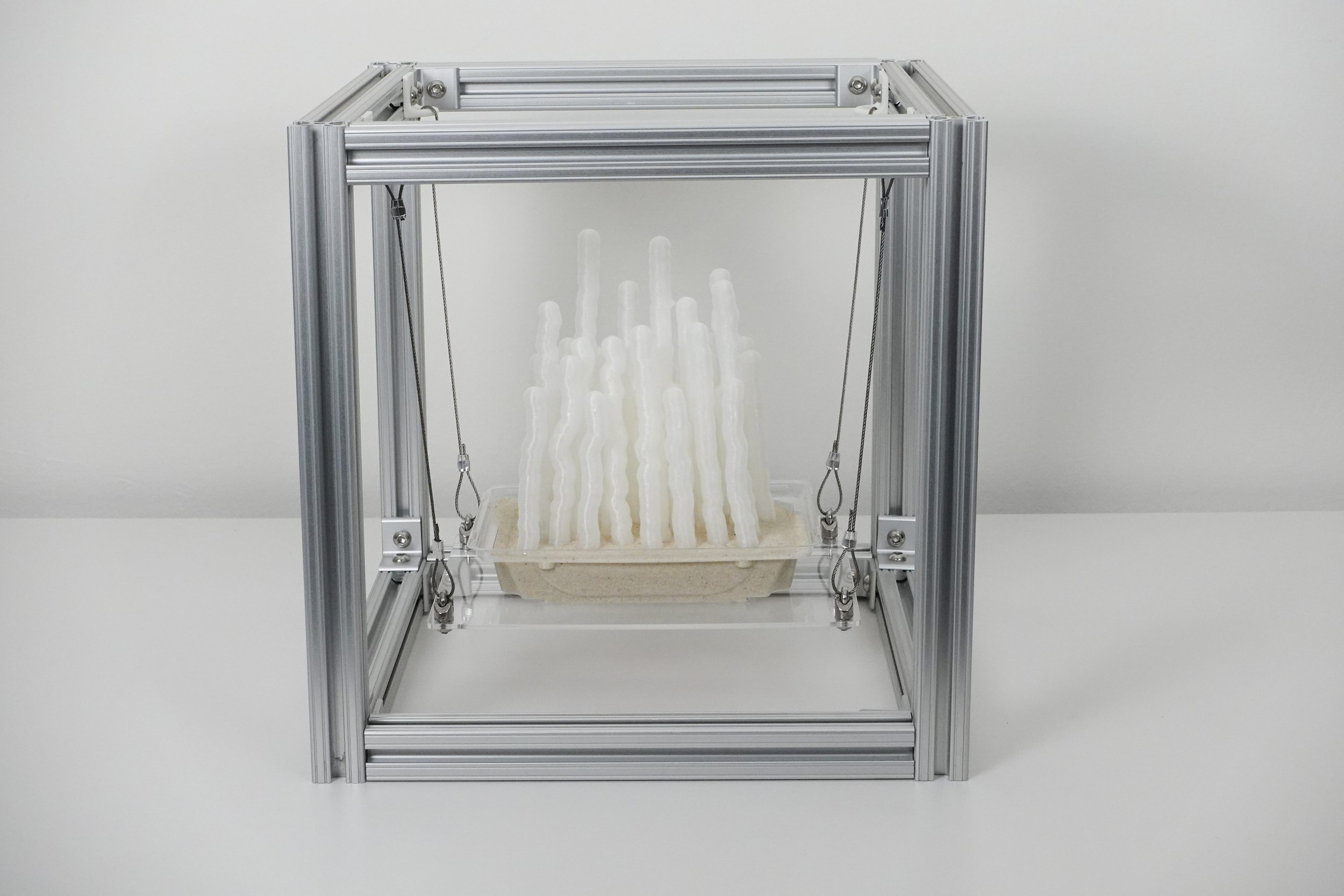 The Hushlands: Microstachys Filiformis, 2025. 3D printed polylactic acid, recycled polyethylene terephthalate, aluminum extrusion, steel cable, acrylic, sand, 12 x 12 x 12 in.