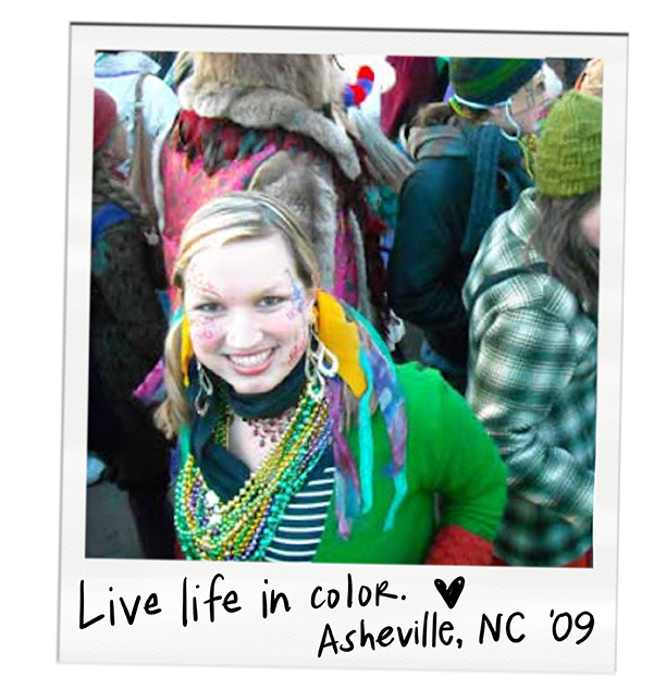 A young woman smiling, wearing colorful beads, with people in festive clothing around her during a celebration in Asheville, North Carolina, 2009.