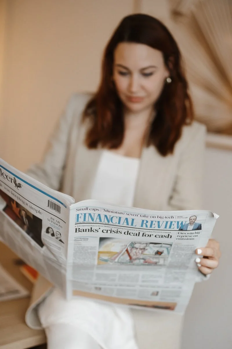 Ashleigh Roberts PR newspaper reading