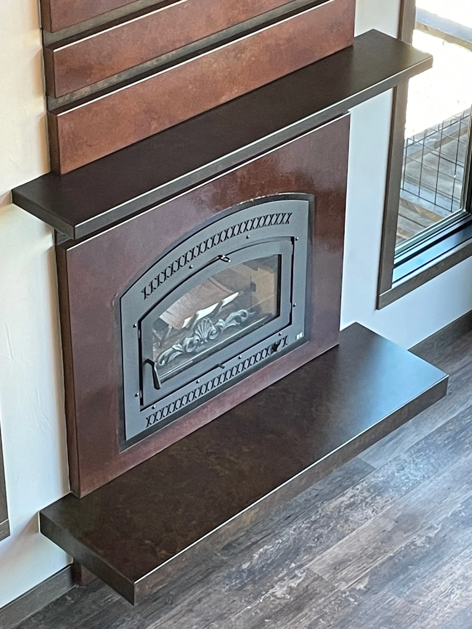 Decorative concrete fireplace hearth and mantle. Our contractors made these floating decorative concrete fireplace pieces in the Black Hills at our shop. Call us today to schedule an expert consultation with us for your Black Hills fireplace needs.