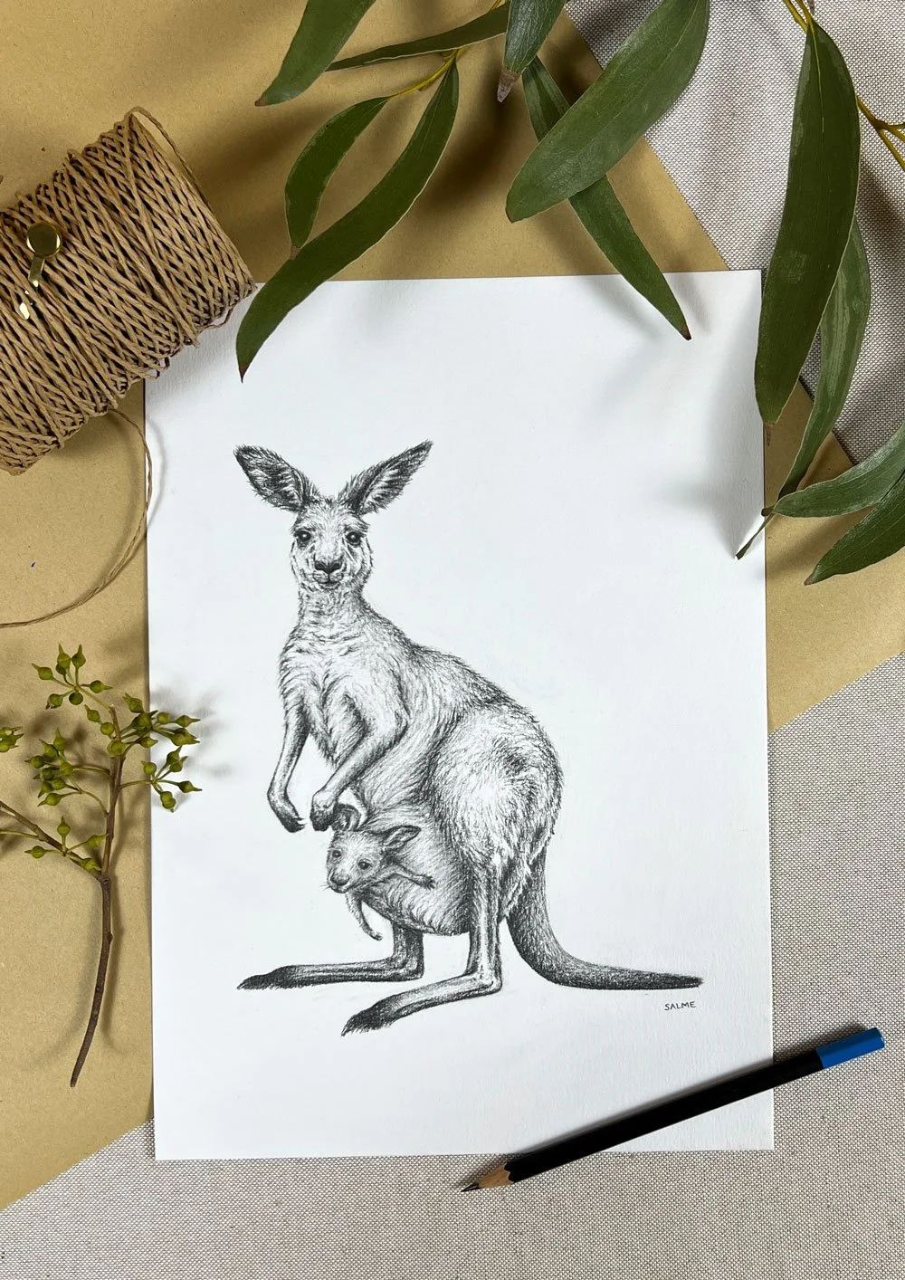Original graphite drawing of a kangaroo mother and her joey amongst gift wrapping decoration