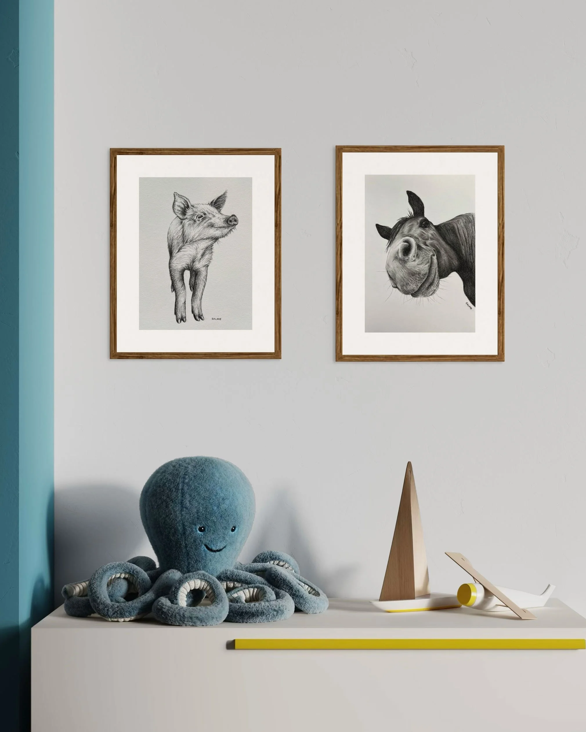 This Little Piggy Stayed Home drawing with Horsing Around drawing framed and displayed in a kids room.