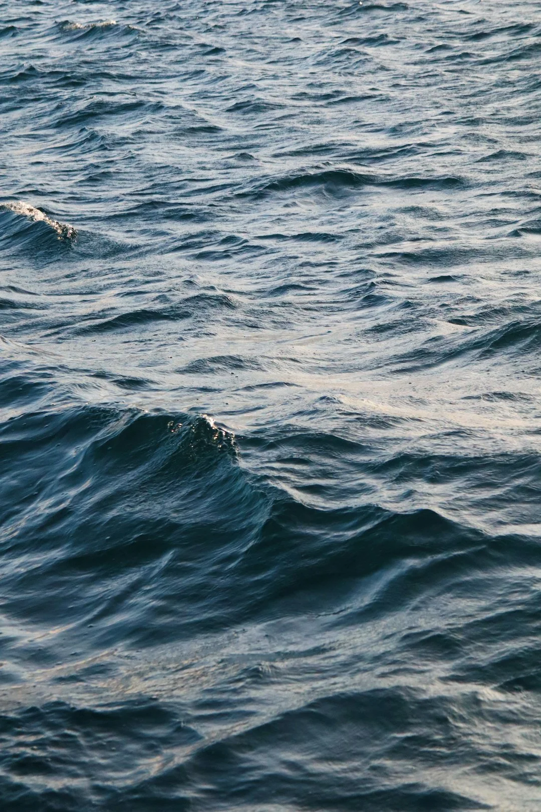 Open ocean surface with waves and ripples in water