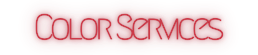 Red neon sign with the words 'Color Services'