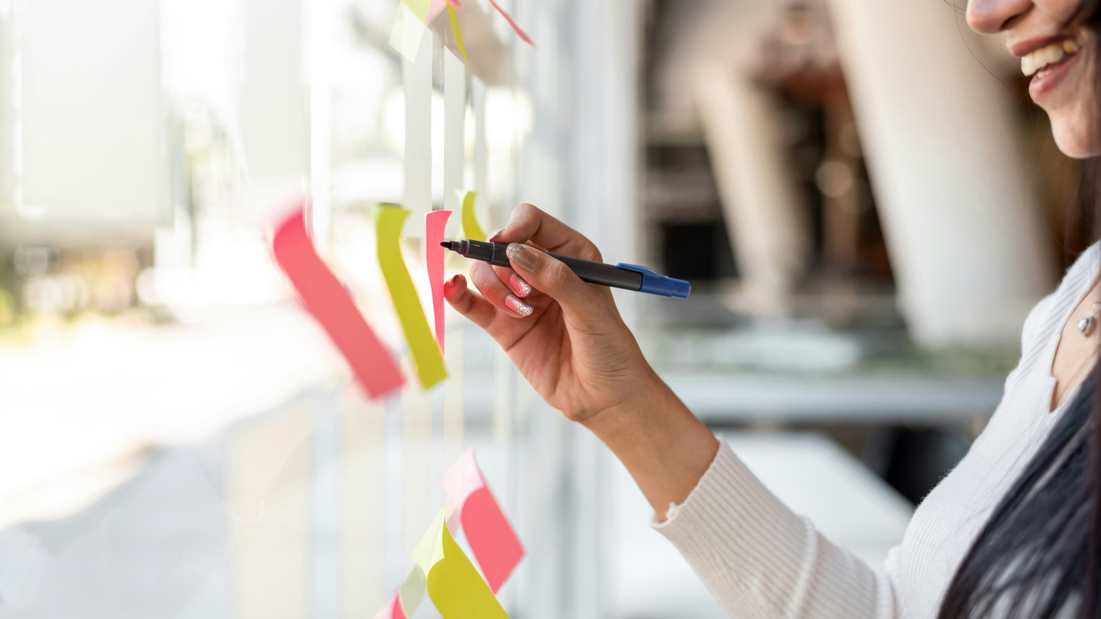 Woman adding to her vision board
