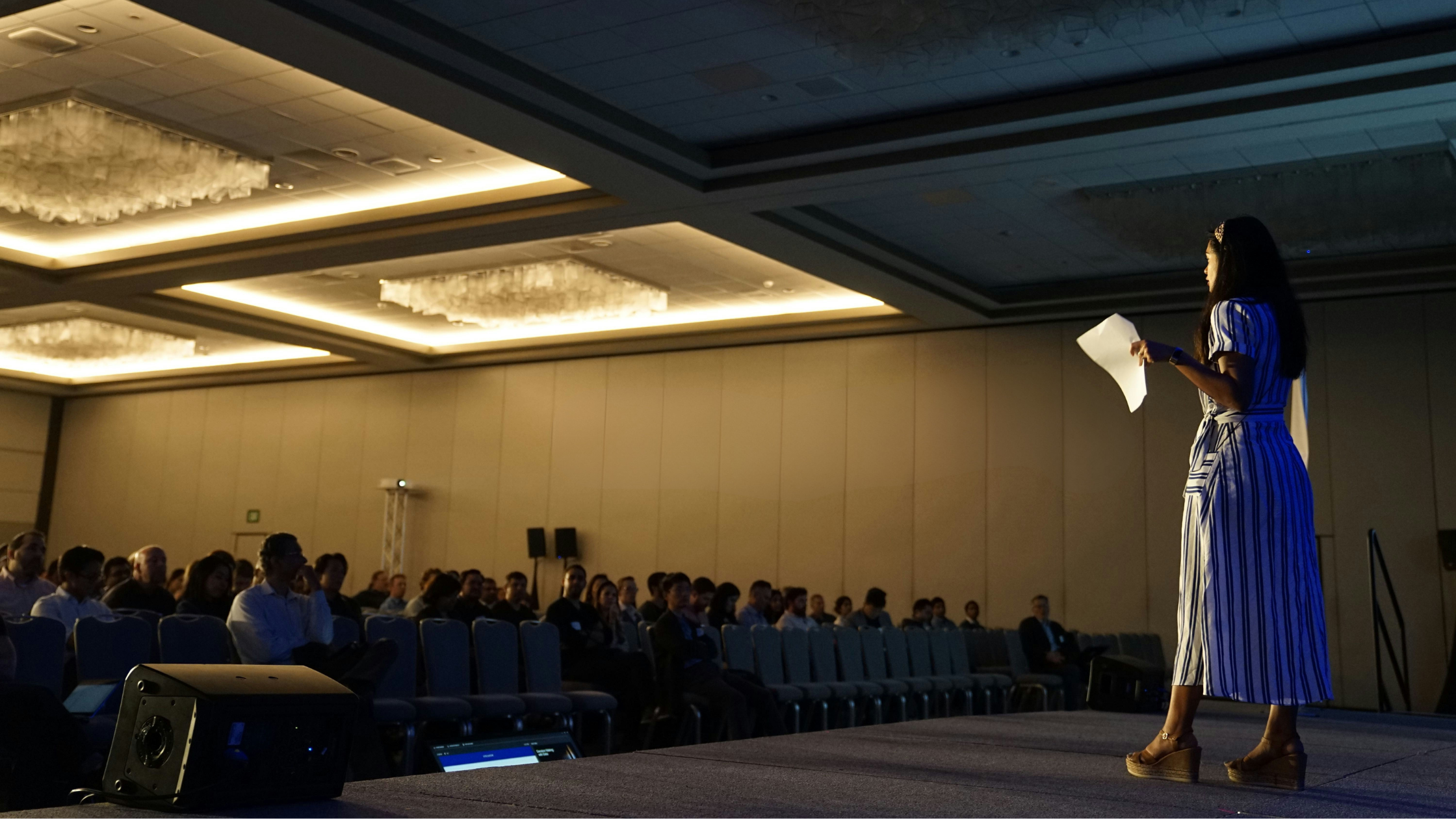 woman public speaking on a stage