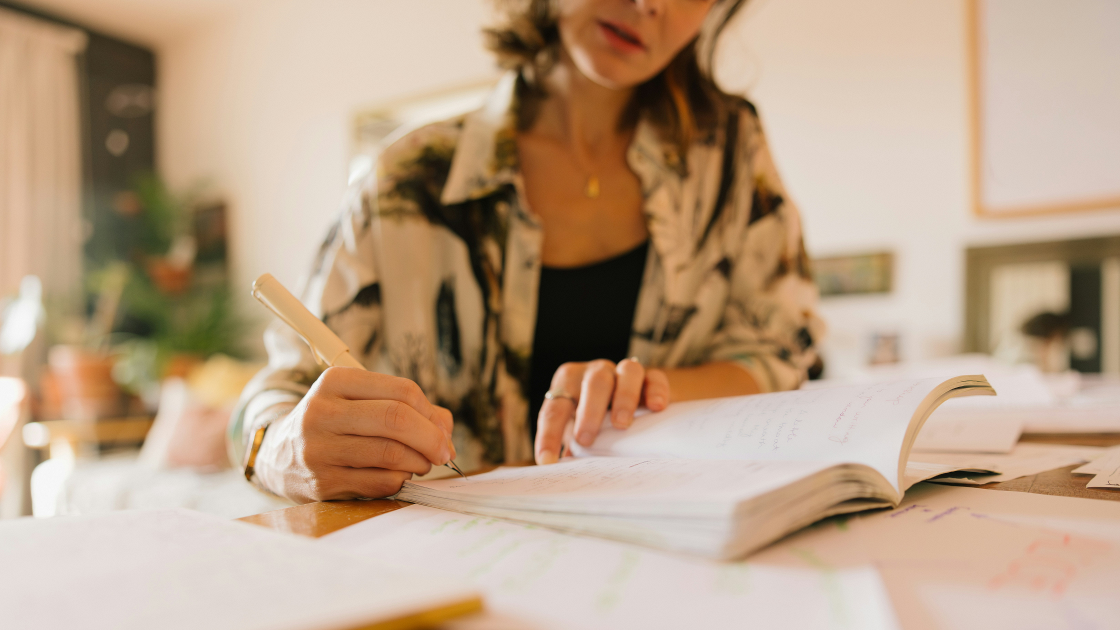Woman writing in a notebook