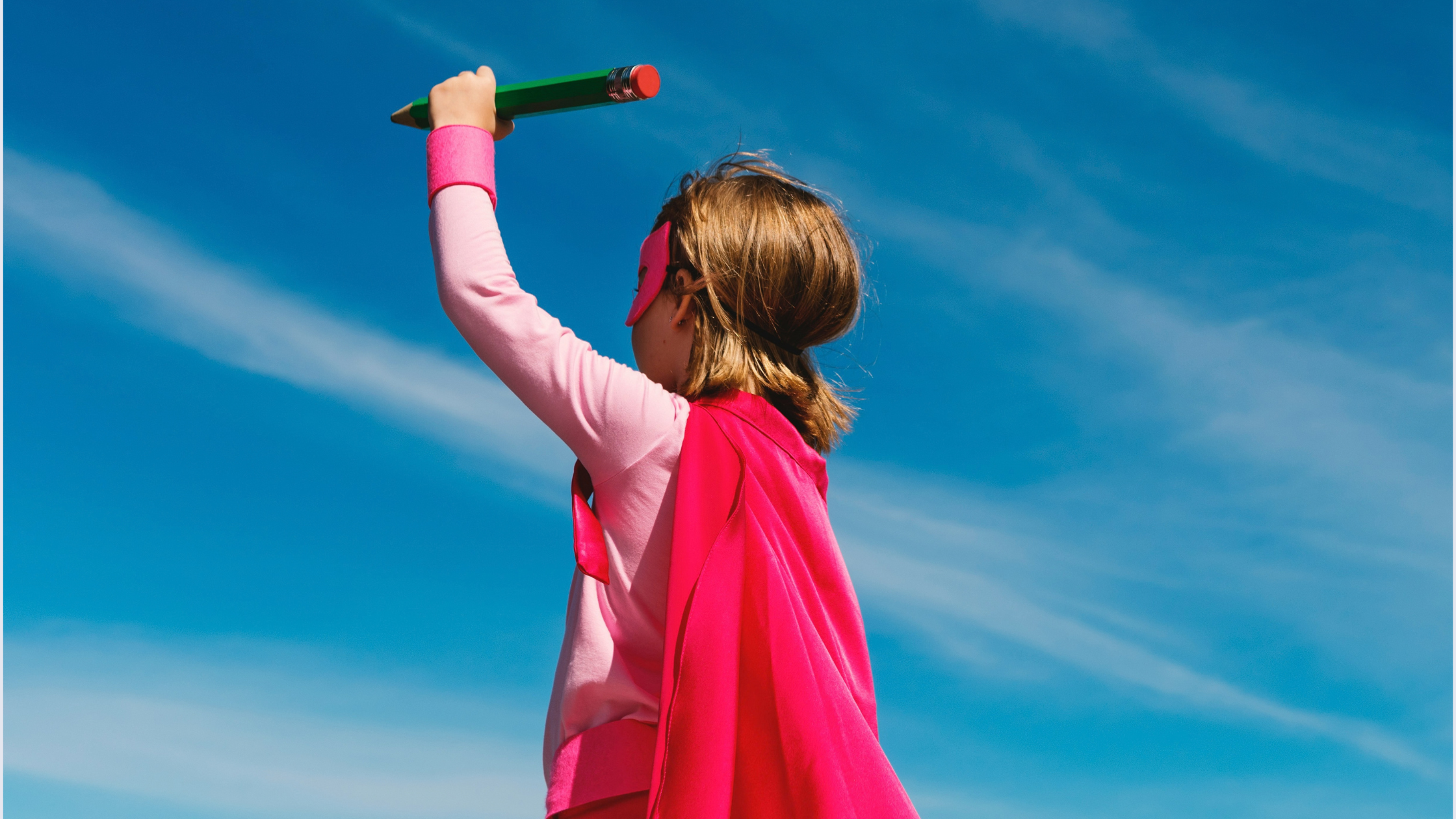 little girl dressed as a superhero