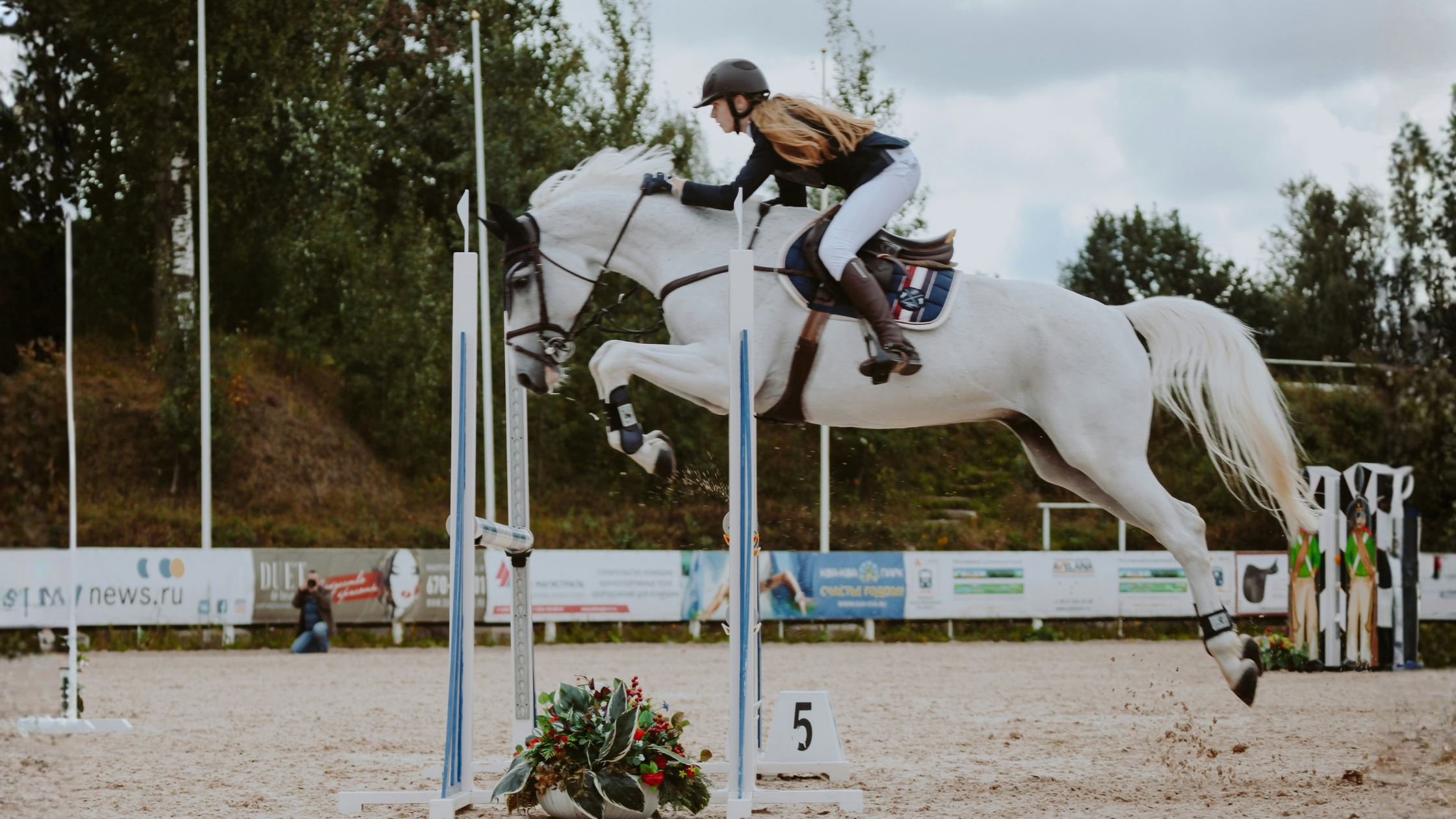 Woman competing with horse
