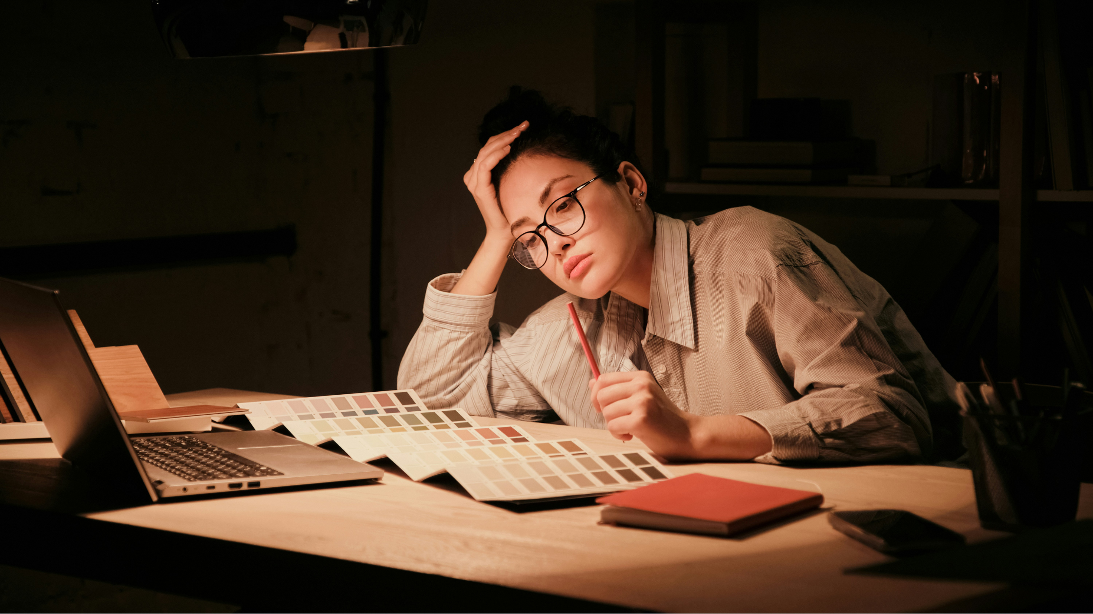 Woman looking overwhelmed while working