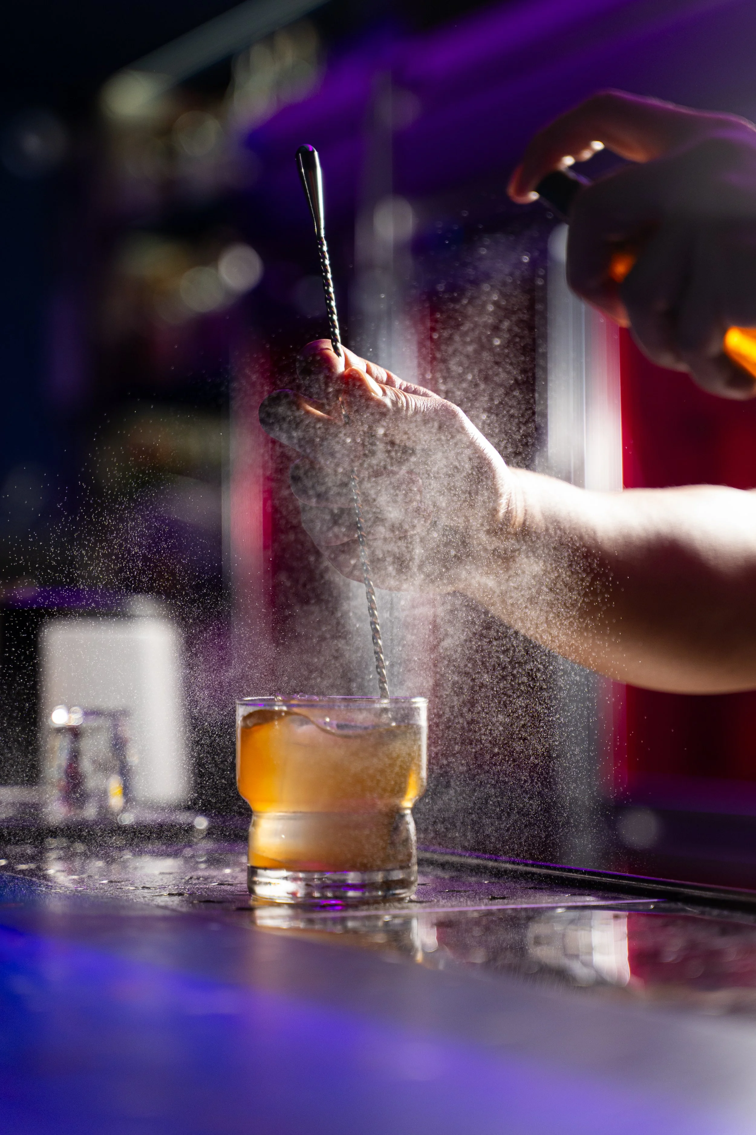 bartender mixing a cocktail