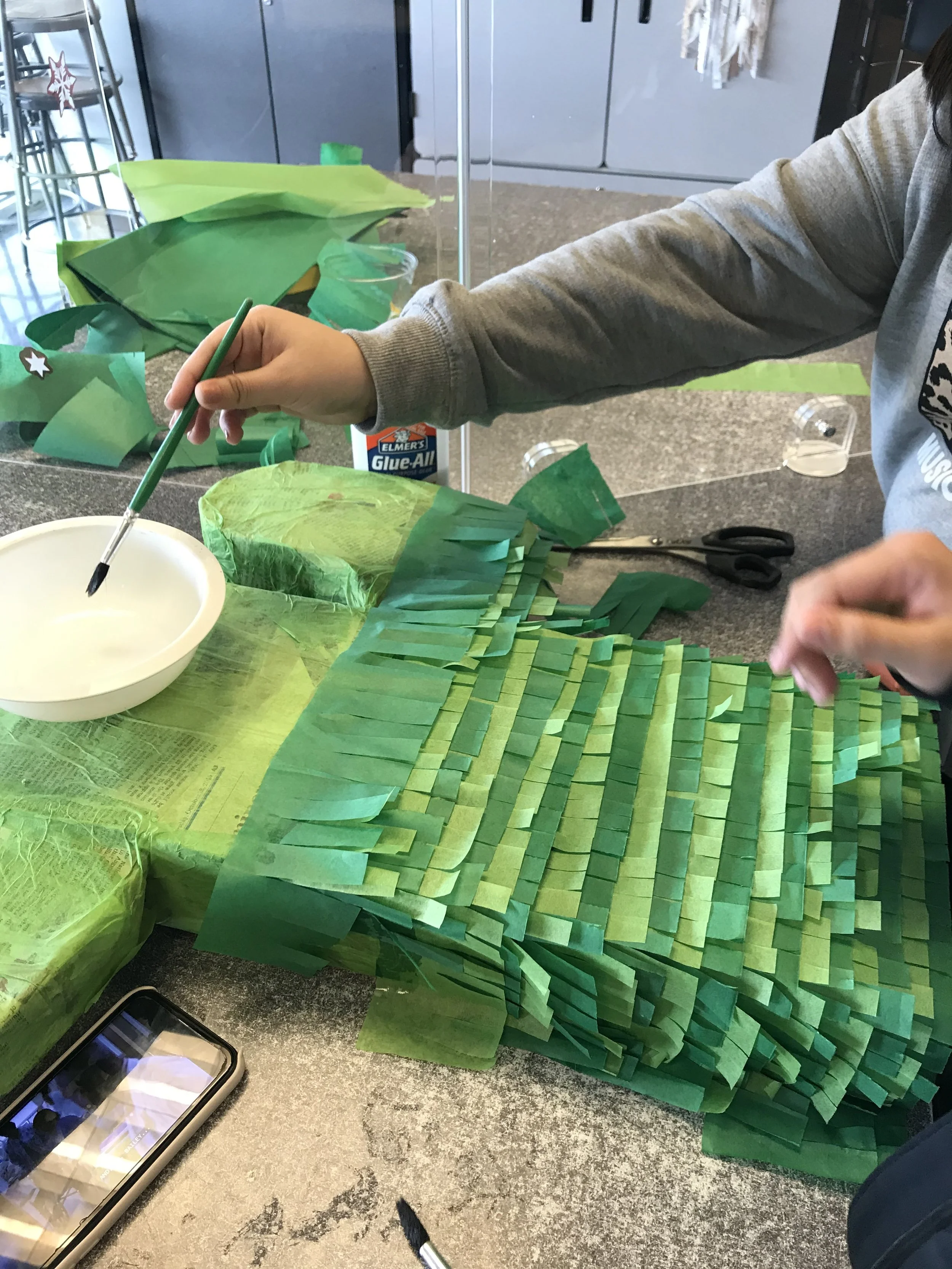 Piñata building with students