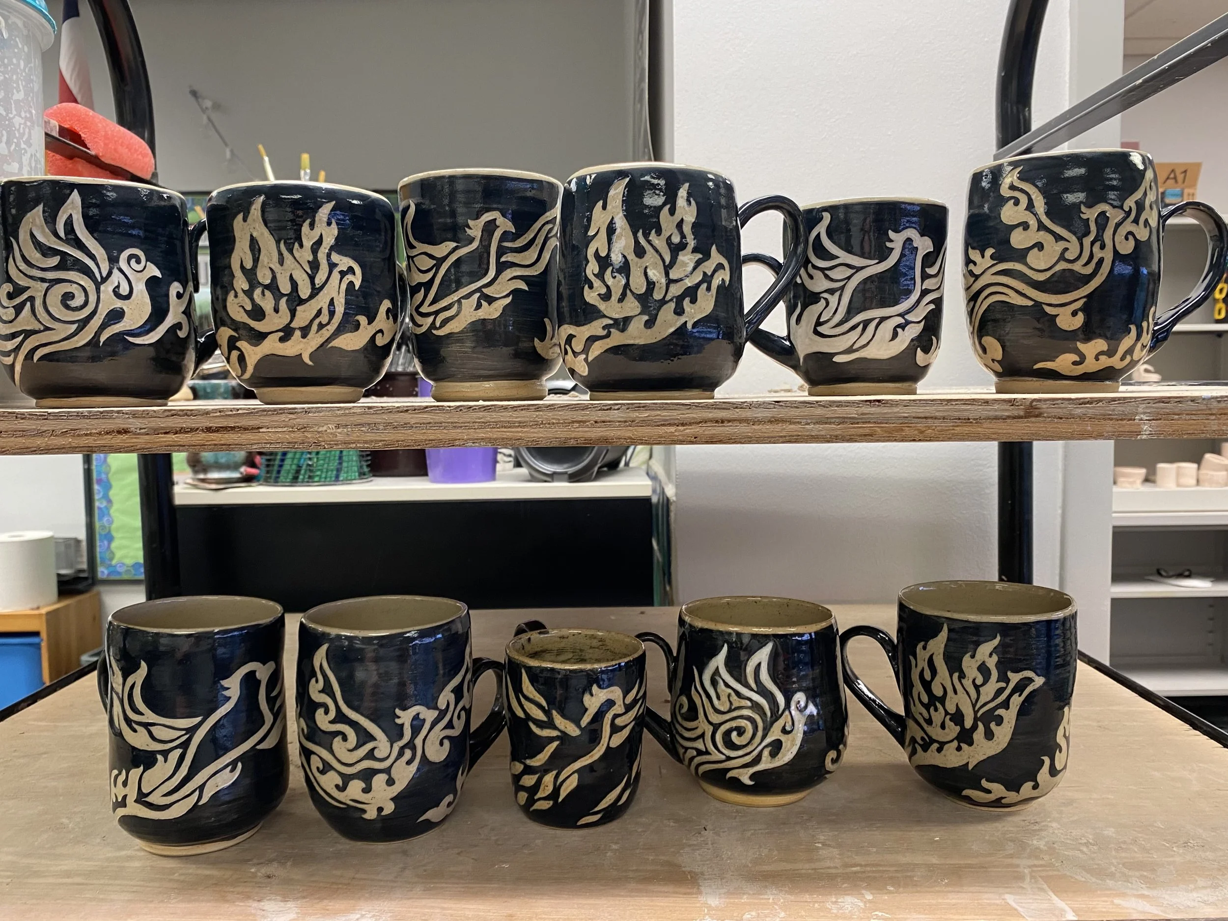 Custom pottery: thrown, sgraffito, clear glazed