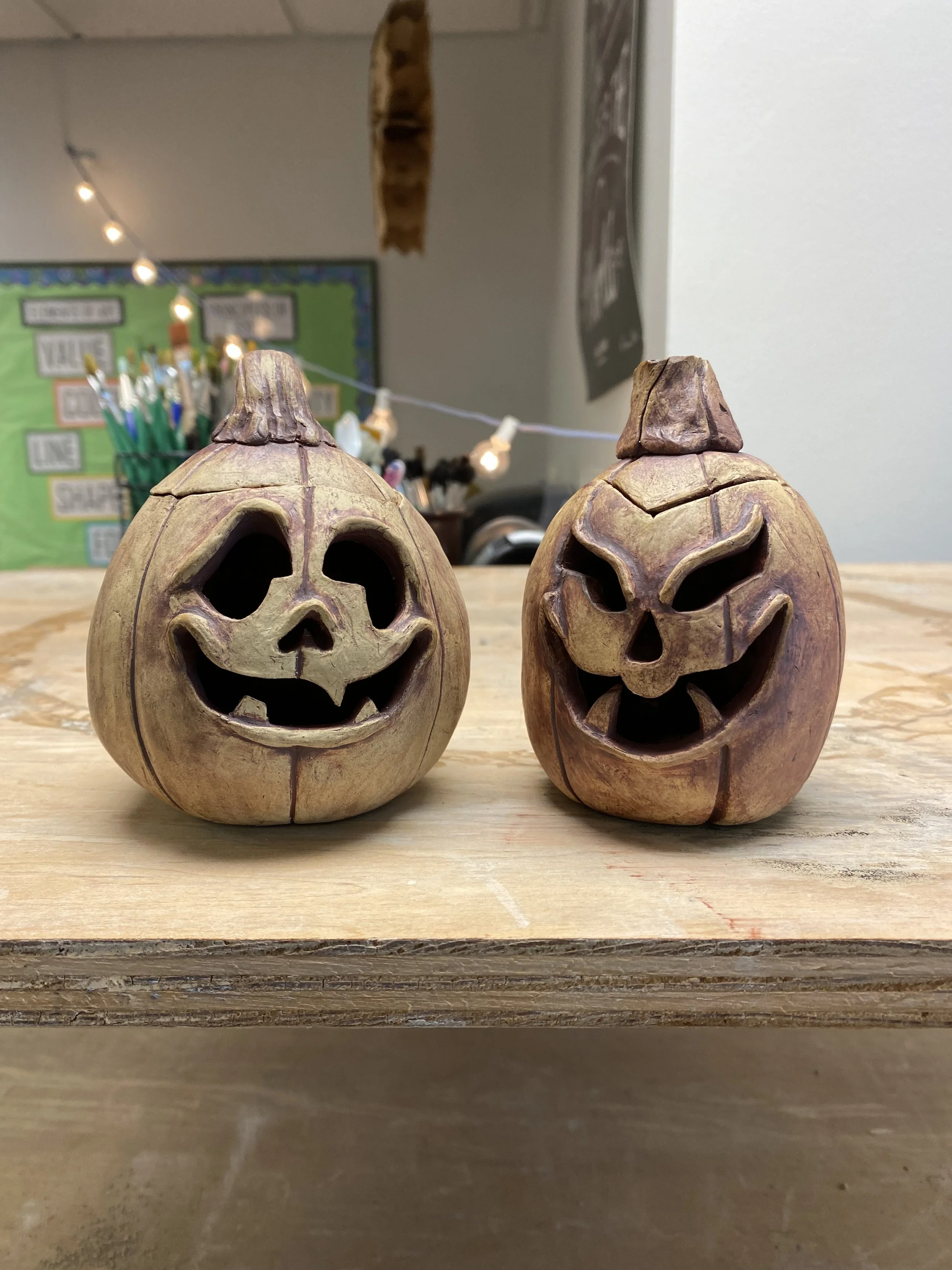 Ceramic jack-o-lanterns with oxide stains on bisqueware
