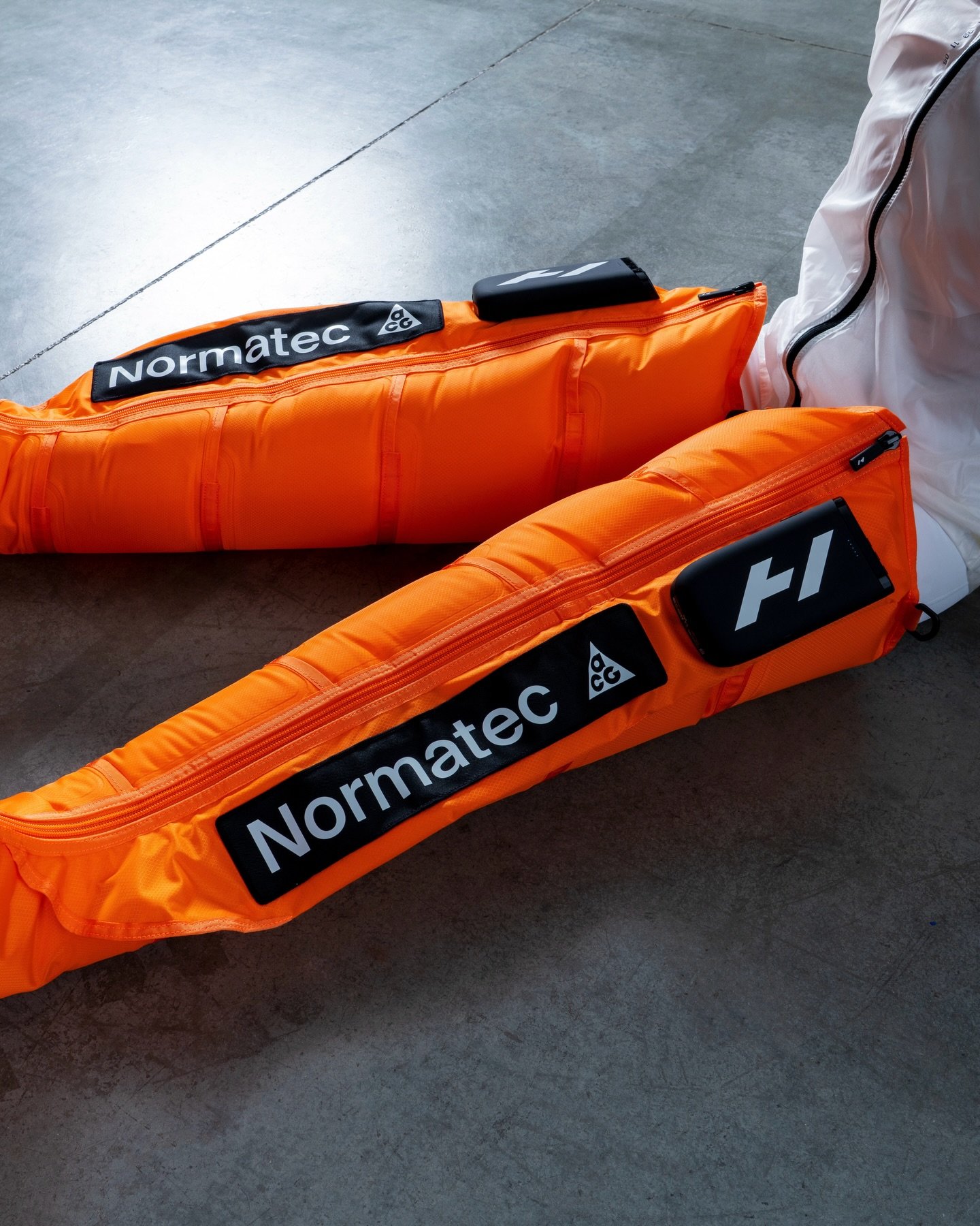 Hyperice x Nike ACG Normatec, in Orange
