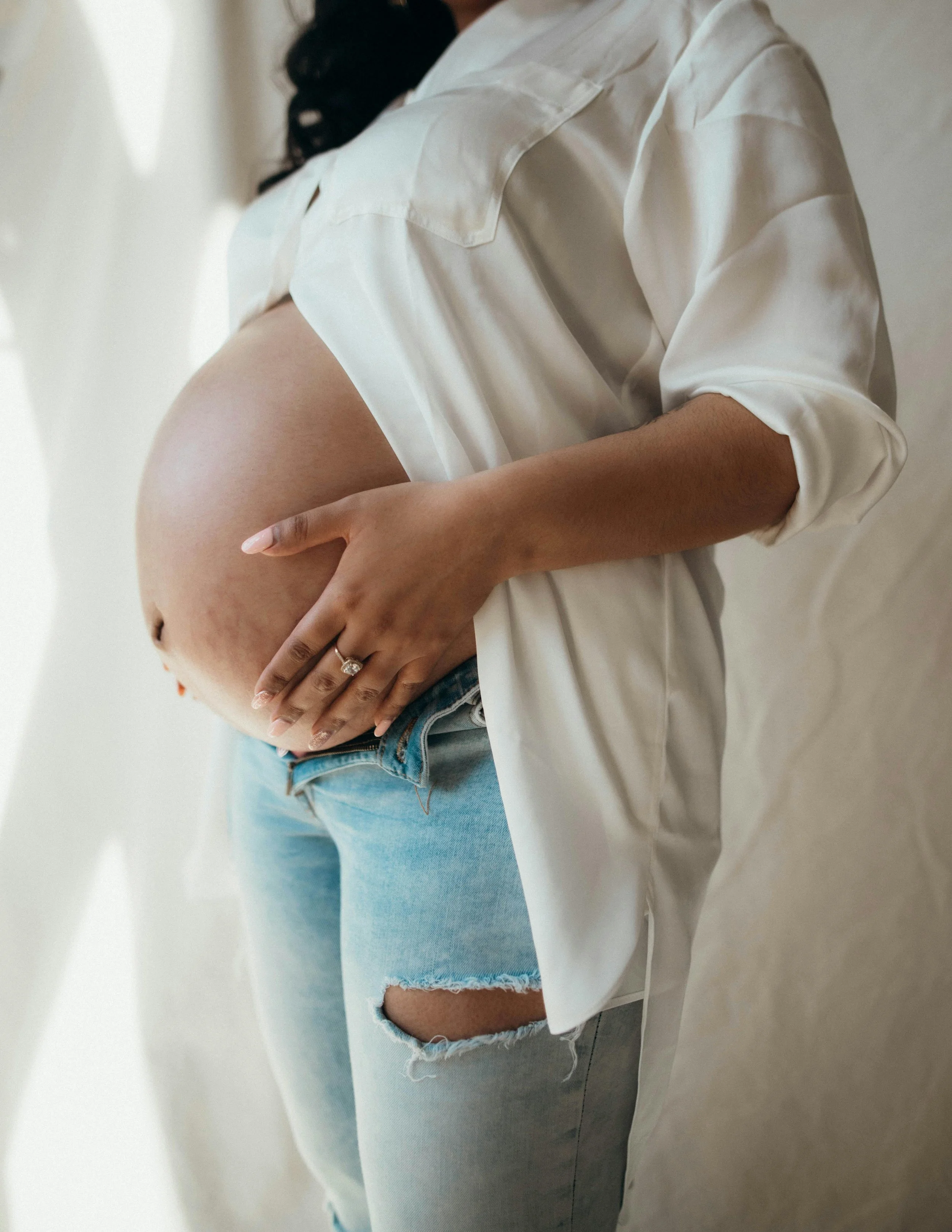 Pregnant woman posing for maternity photography session in Orange County, California.